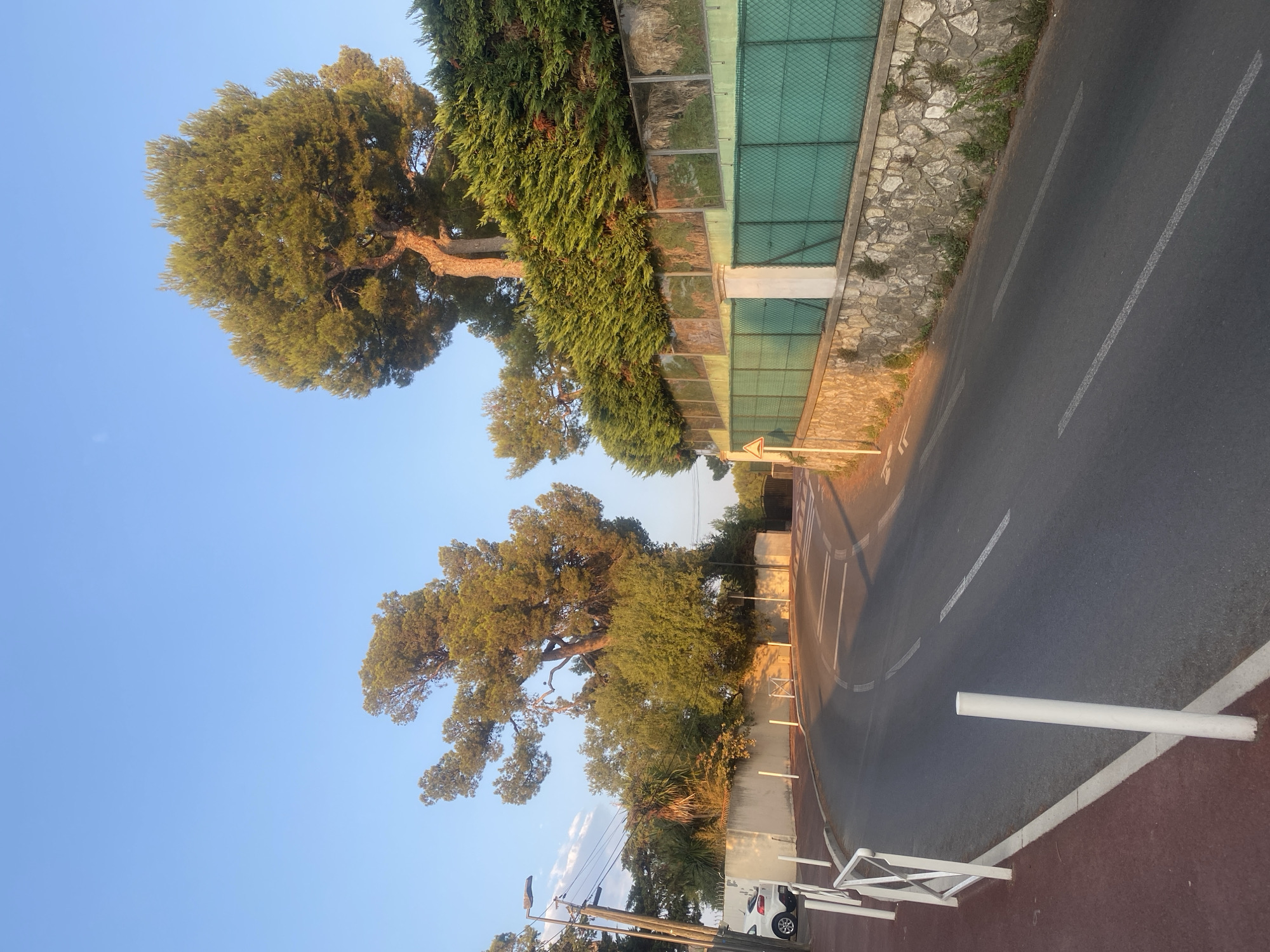 Golden-hour drive along the Antibes coastline at sunset