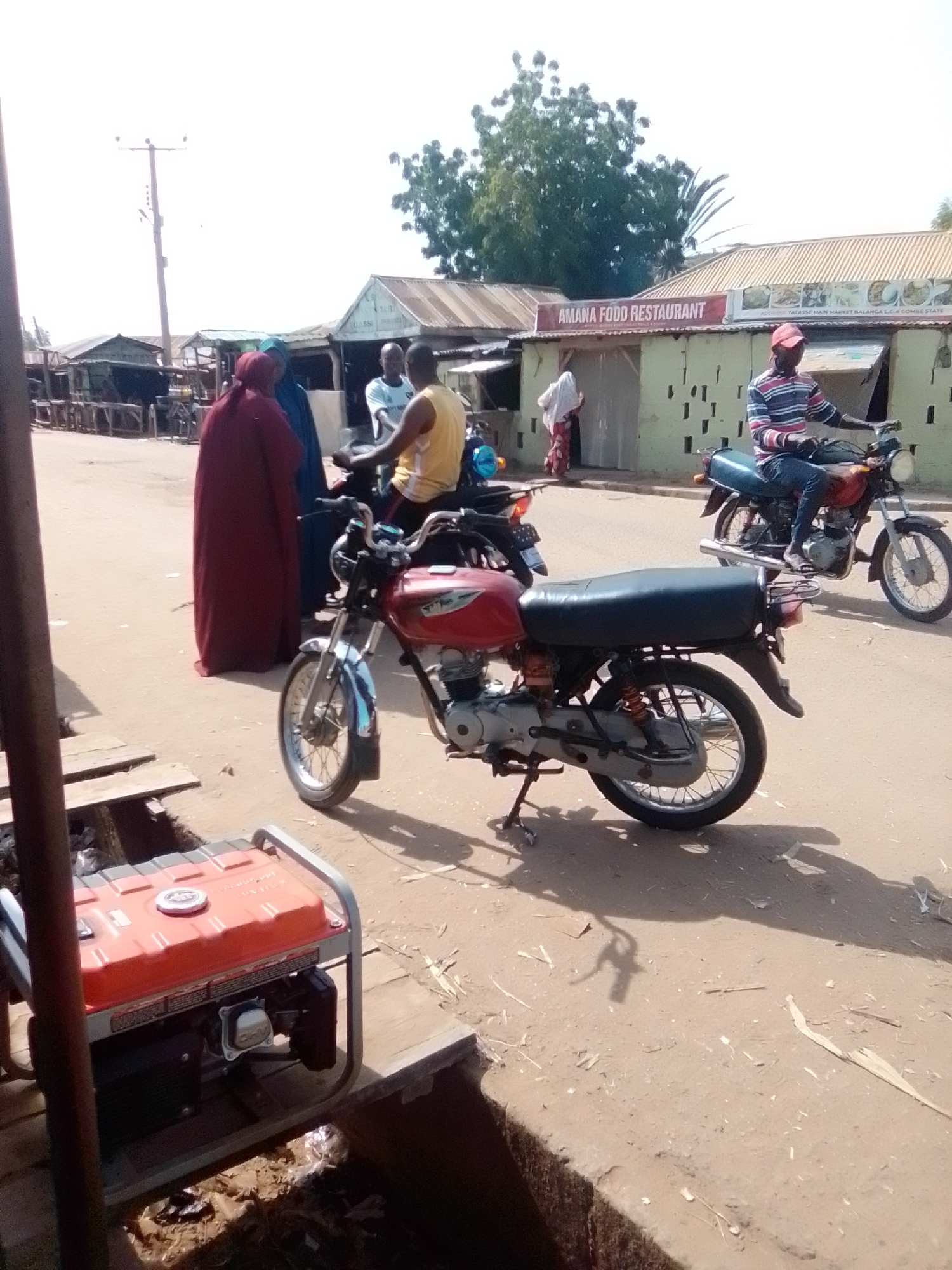 Morning activity across Talasse's market streets and dirt roads