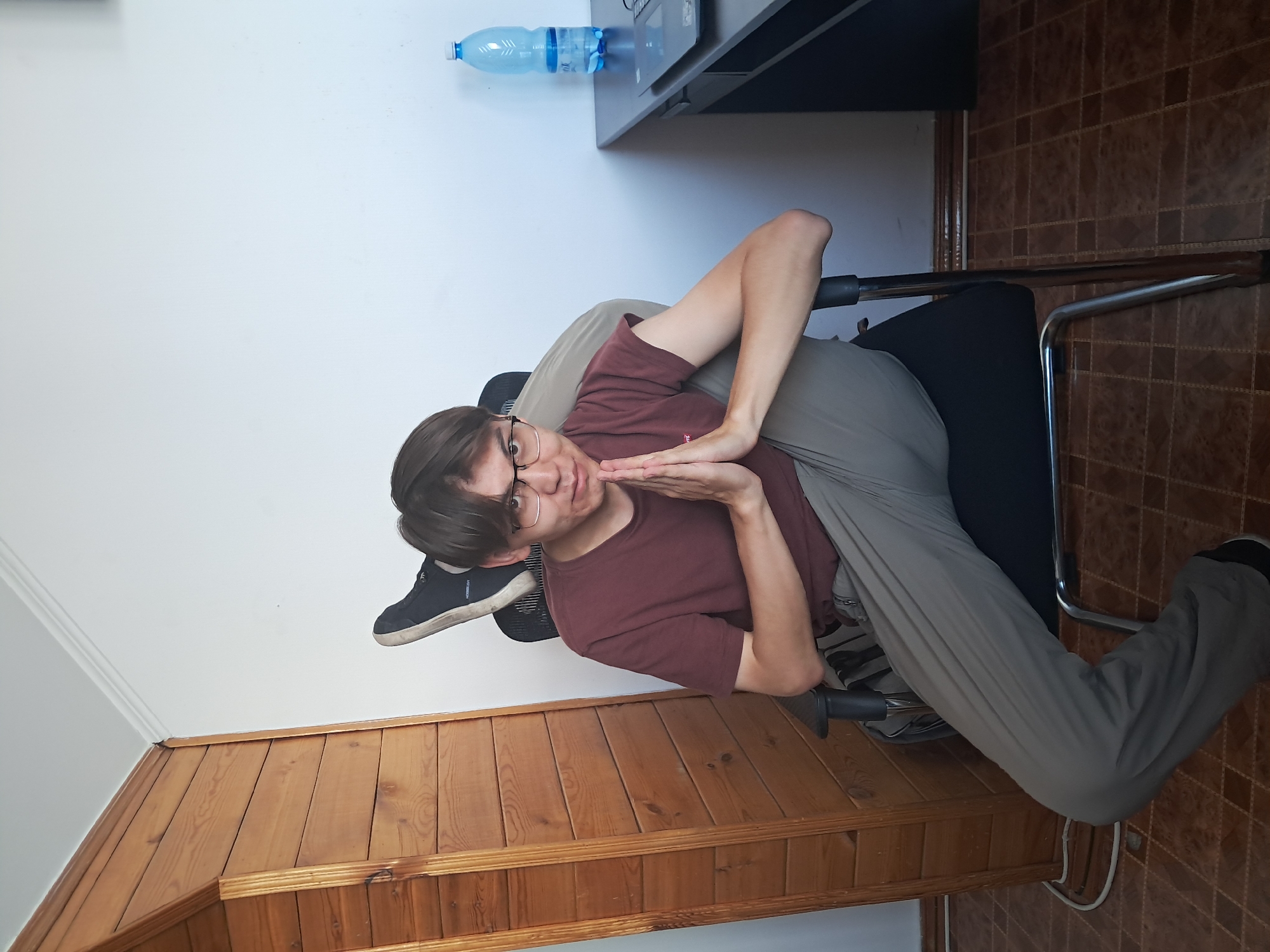 Desk setup and details at a Bishkek office, mid-morning