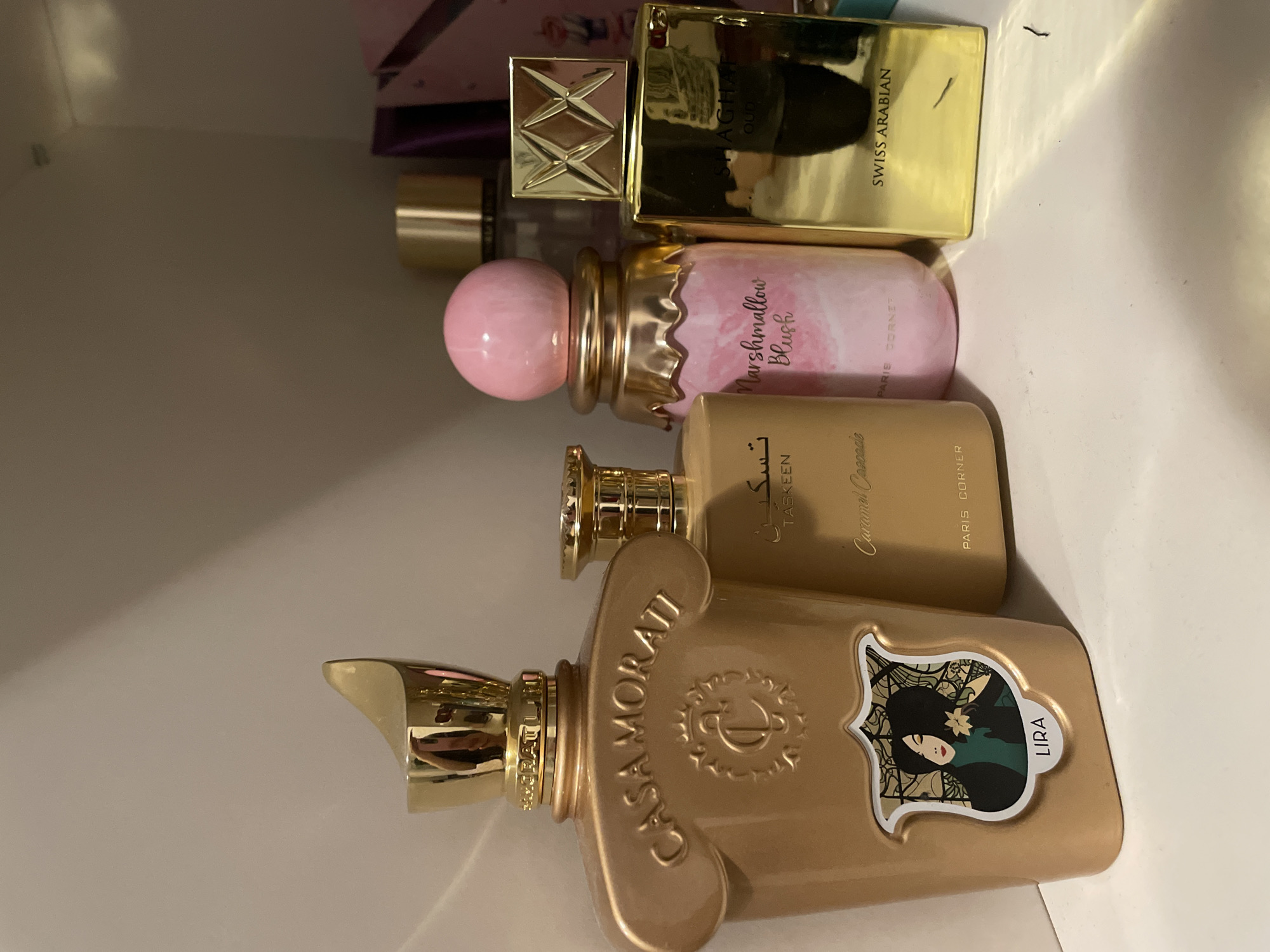 Indoor scenes: perfume display and sunset window reflection captured