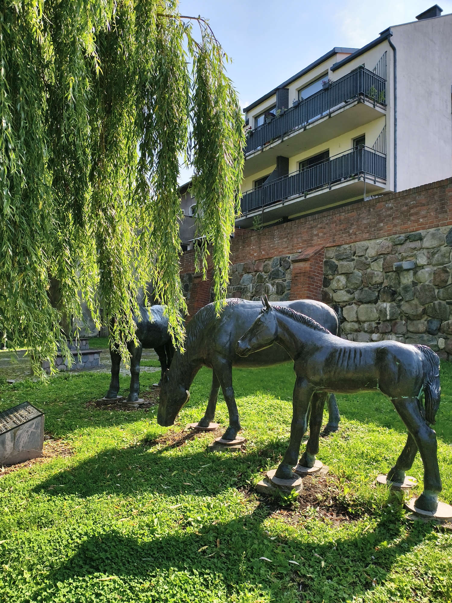 Church, lake, and outdoor sculptures in Sztum, Poland