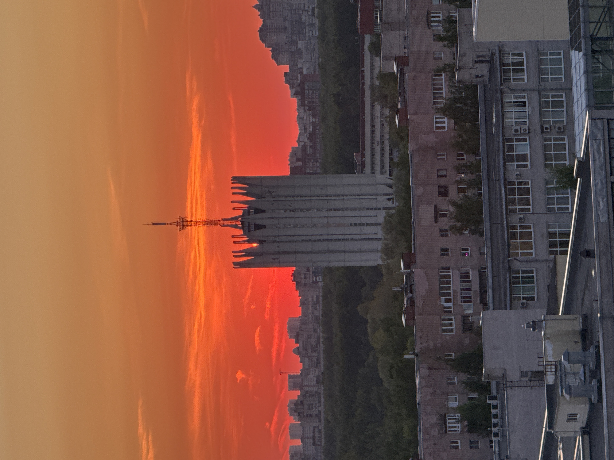 Vibrant sunset illuminates Saint Petersburg skyline with orange-red colors