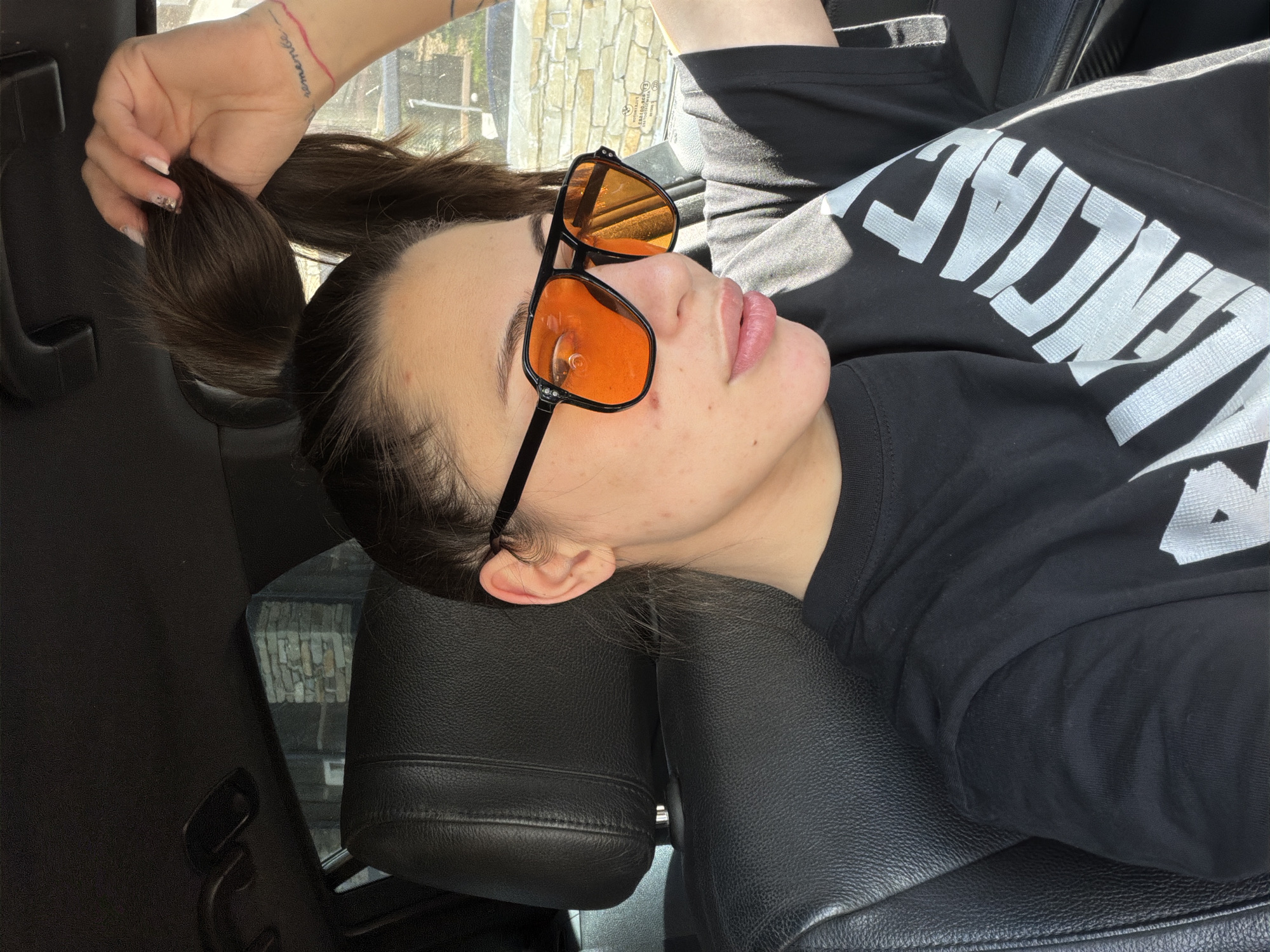 Woman spotted relaxing in car passenger seat in Bansko