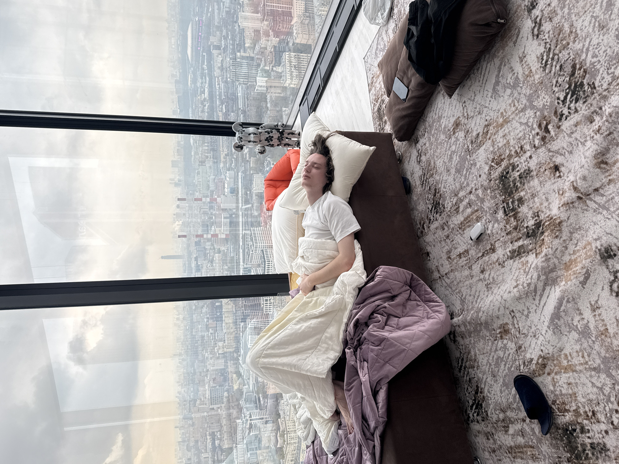Young man rests on sofa in Khimki, Russia