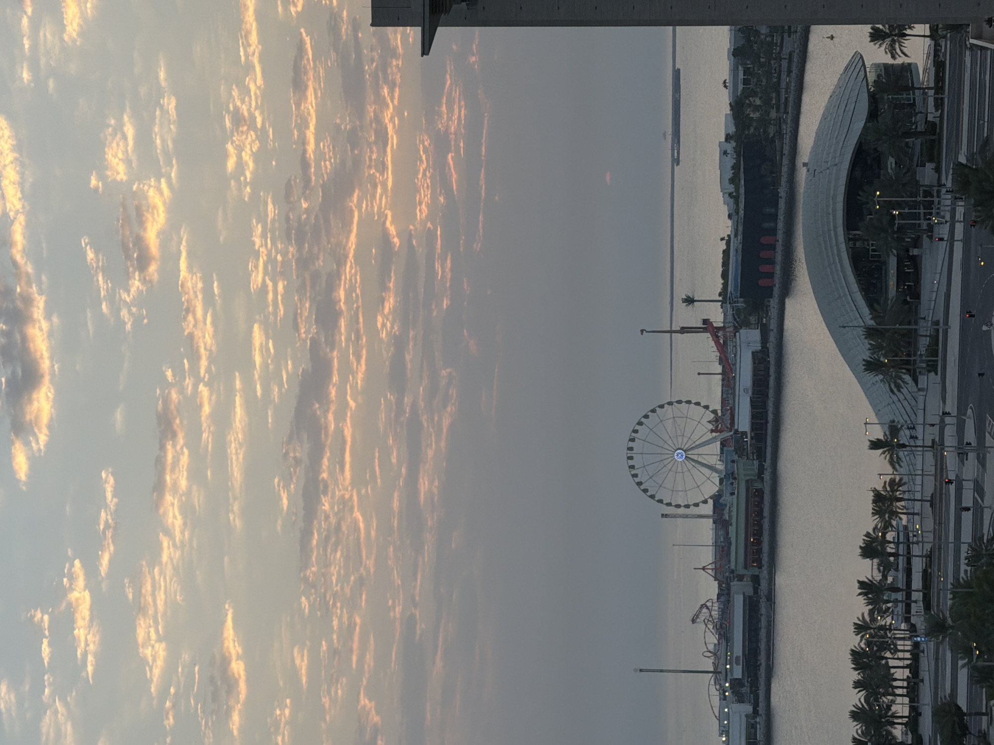 Lusail waterfront glows at dusk, multiple angles