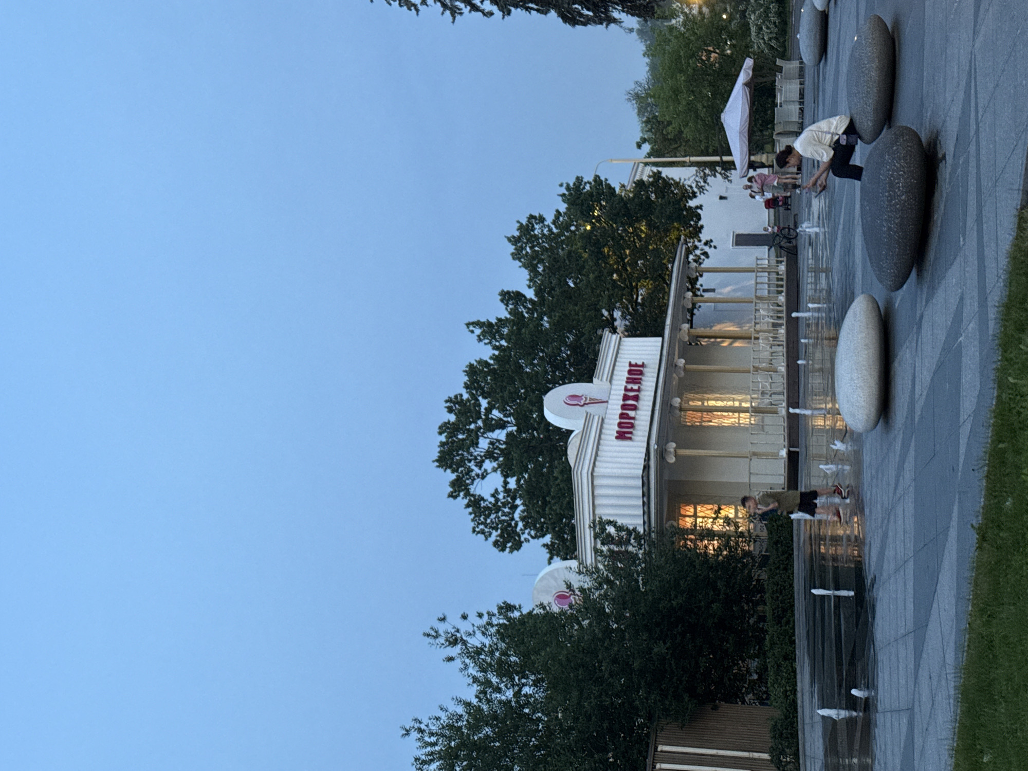 Evening scenes captured near Moscow ice cream stand and orchard