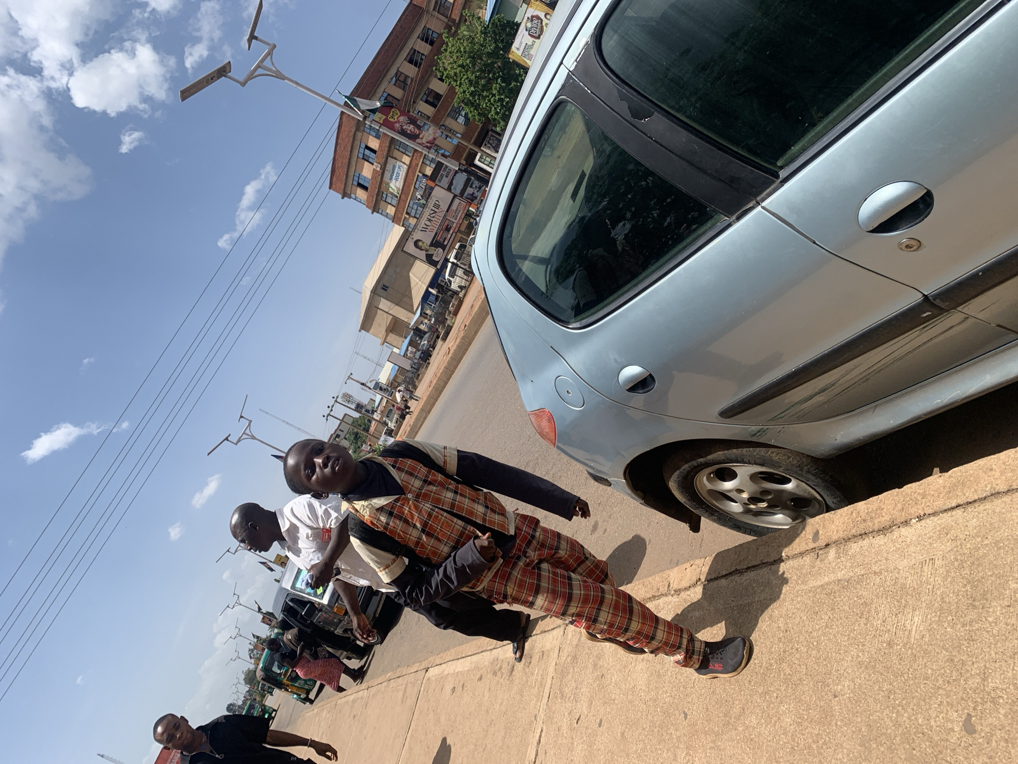 Midday street life and commerce documented across Jos, Nigeria