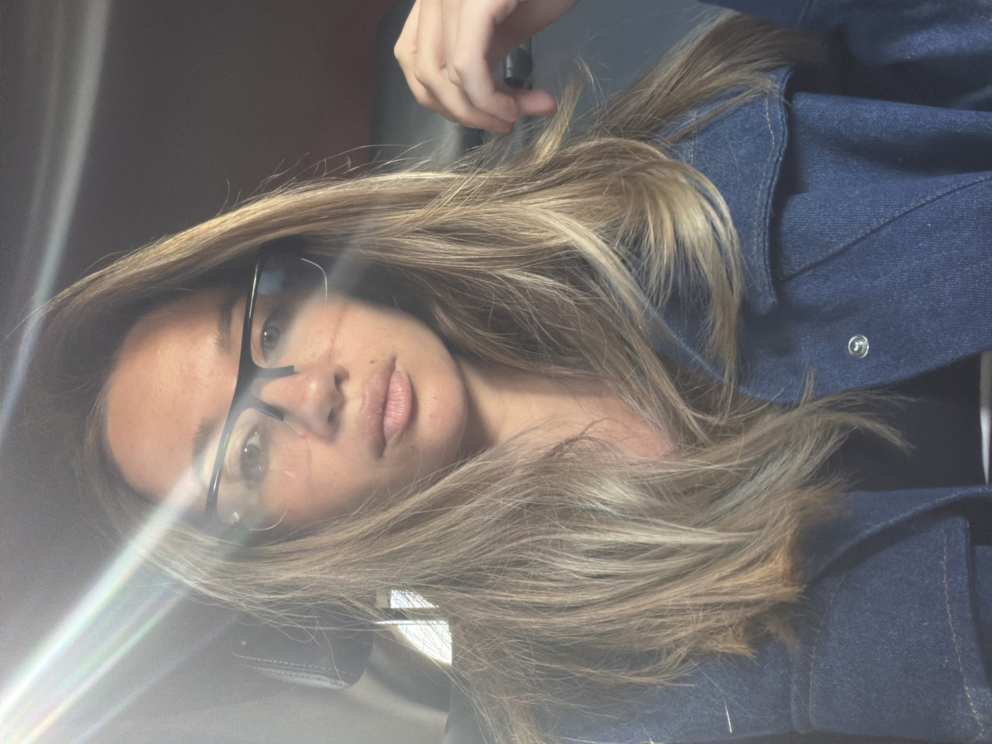 Woman in denim jacket observed inside vehicle Friday morning