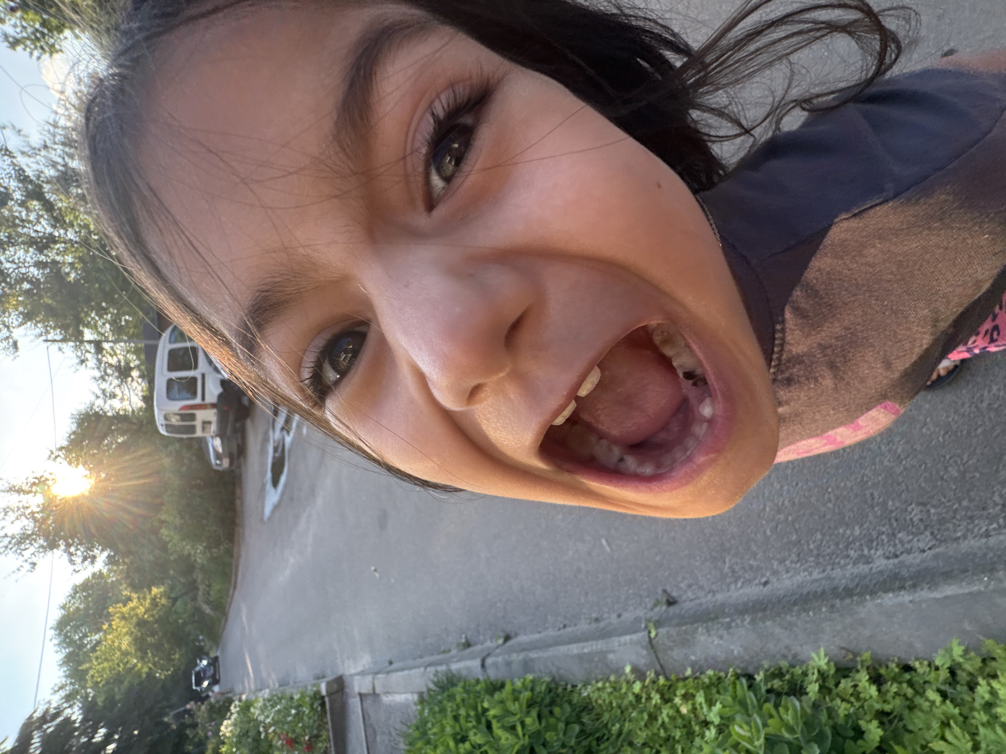 Girl in Stitch shirt plays on residential streets