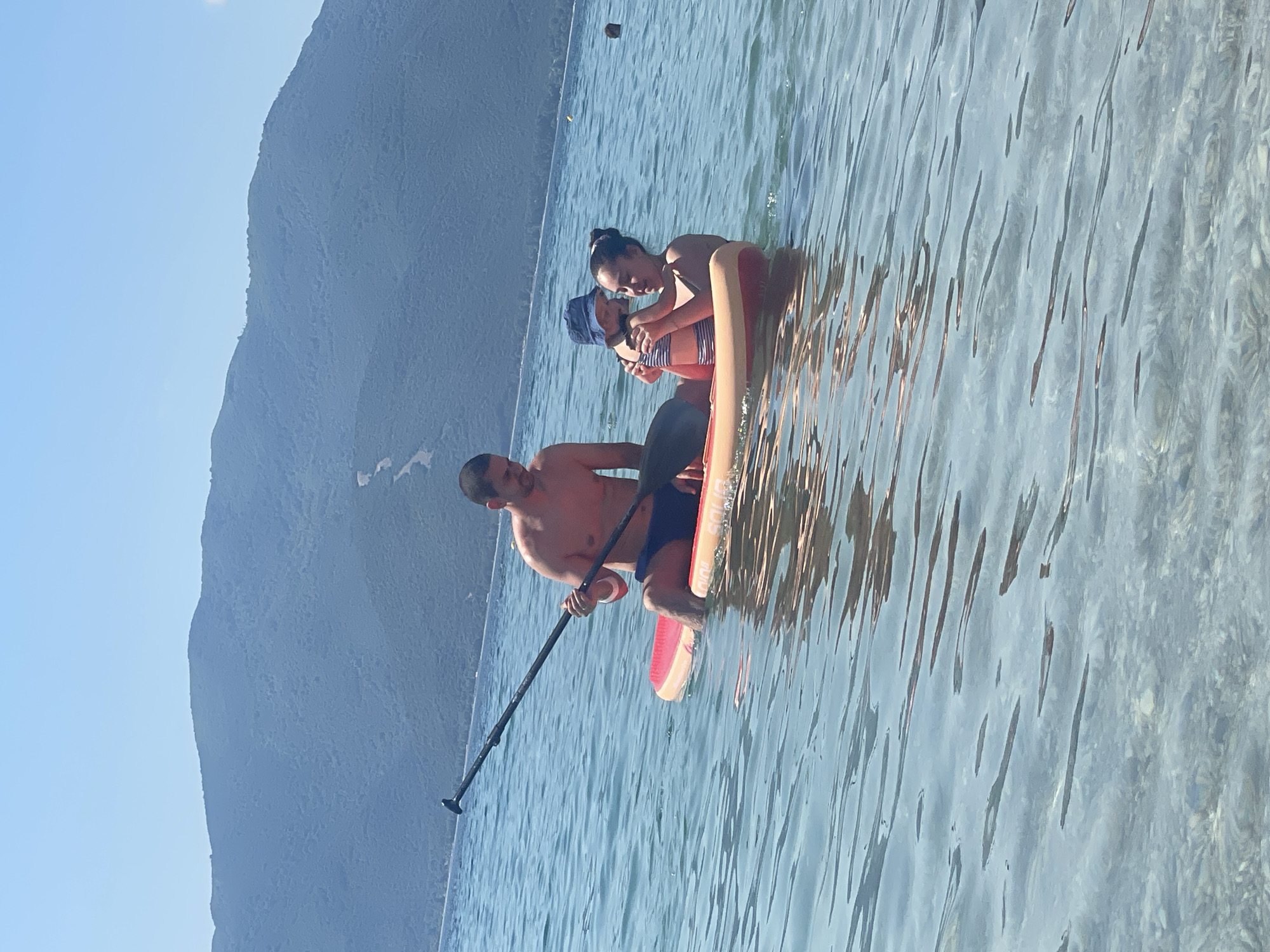 Family enjoys morning beach activities in Nea Vrasna, Greece