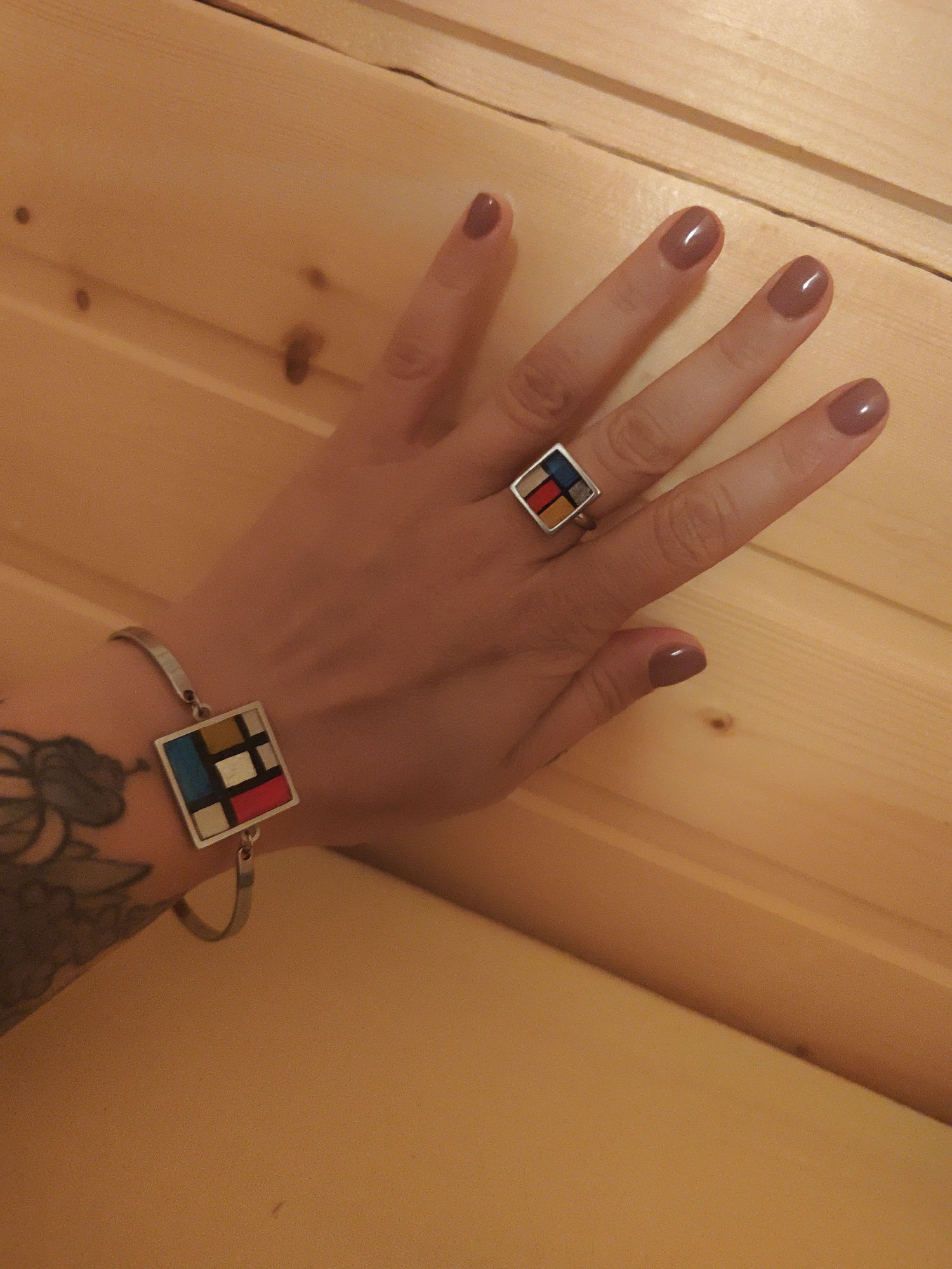 Woman photographs herself and jewelry in Russian village