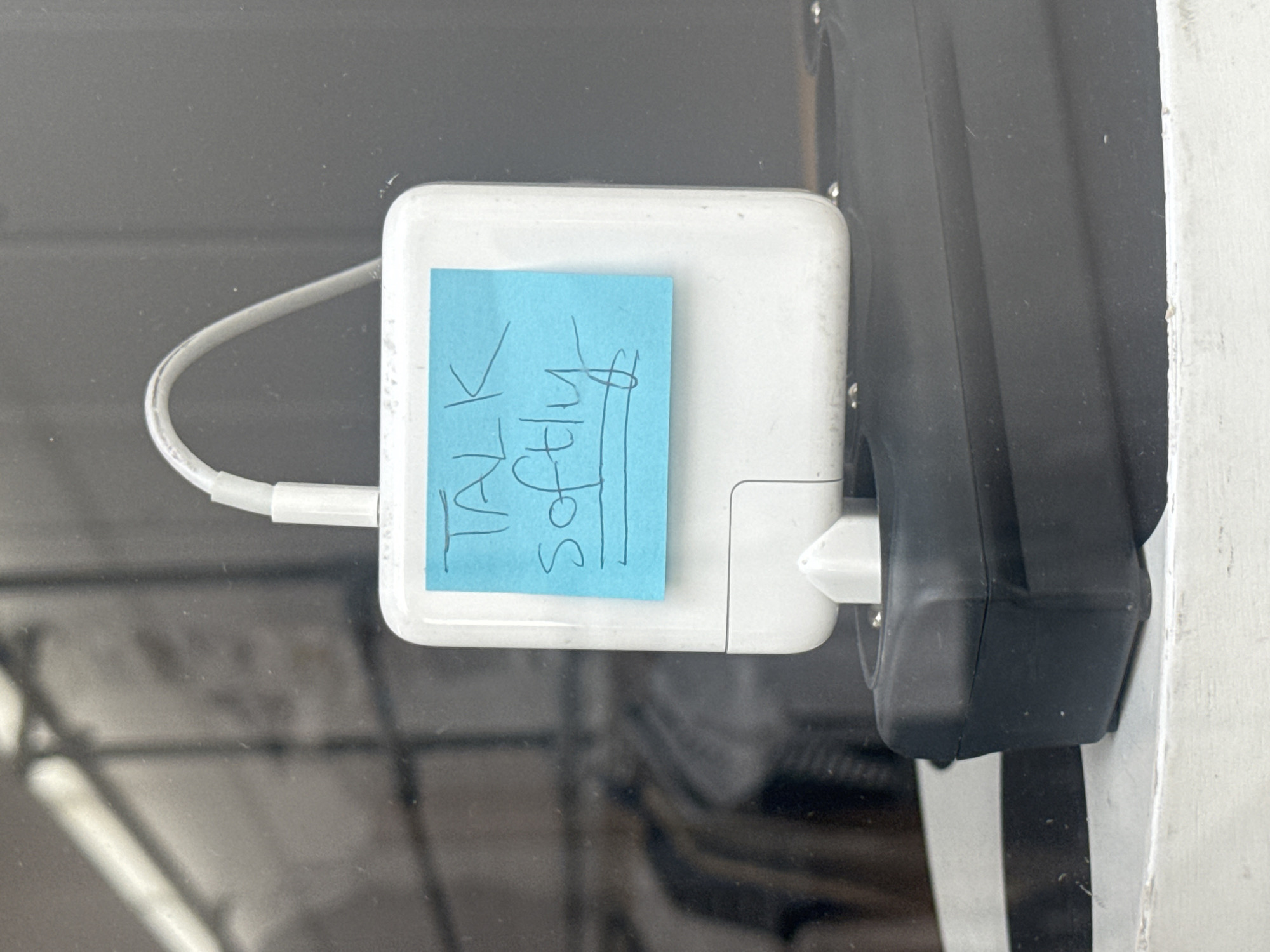 White power adapter observed charging in Paris electrical socket