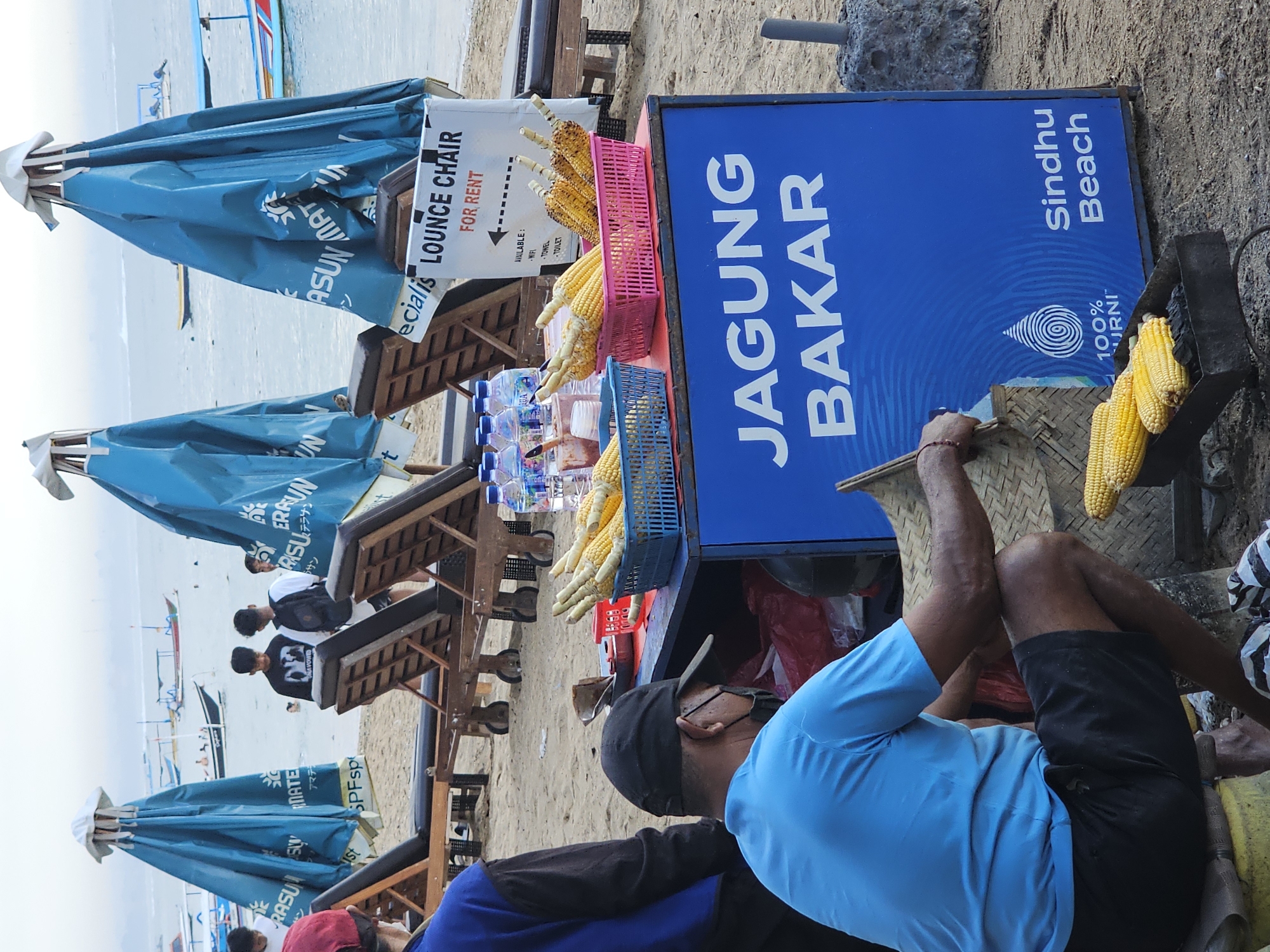 Busy afternoon at Sindhu Beach with vendors and beachgoers