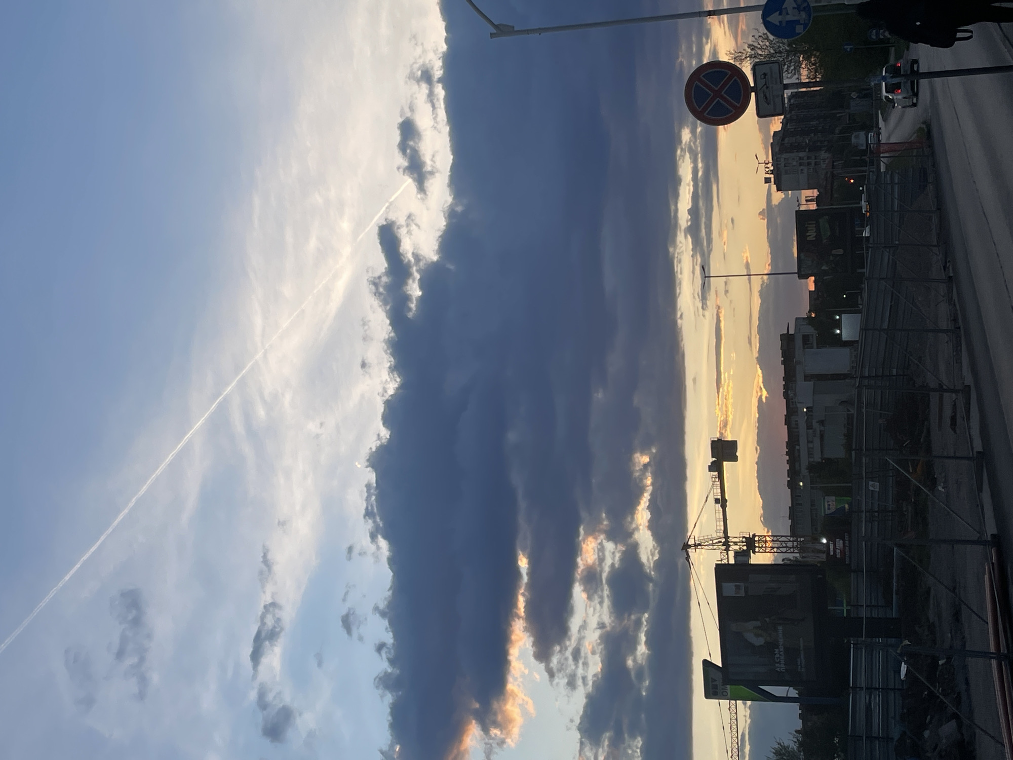 Dramatic sunset contrasts with storm clouds over Sofia streets