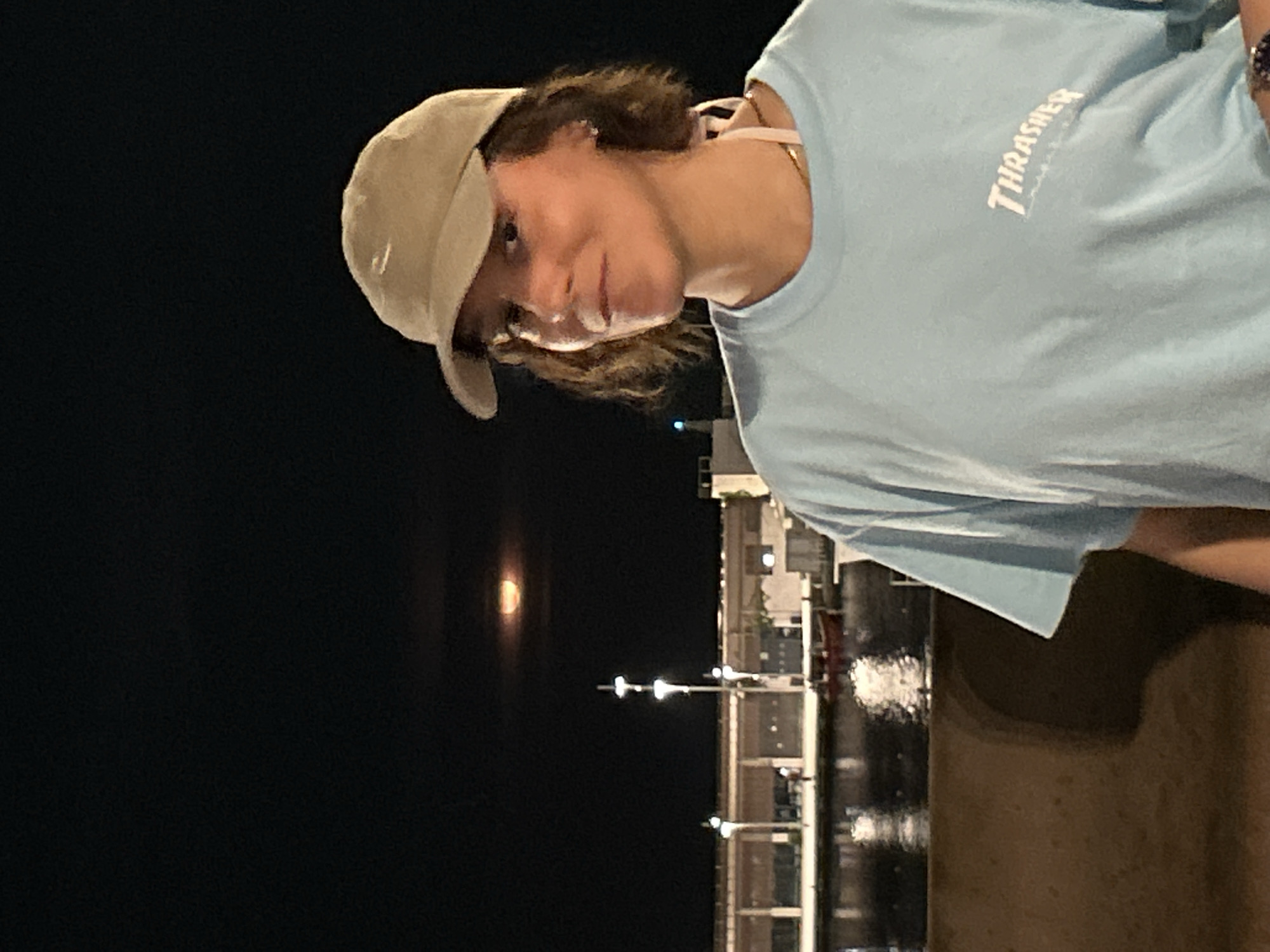 Person spotted at Barcelona waterfront near Torre Glòries at night