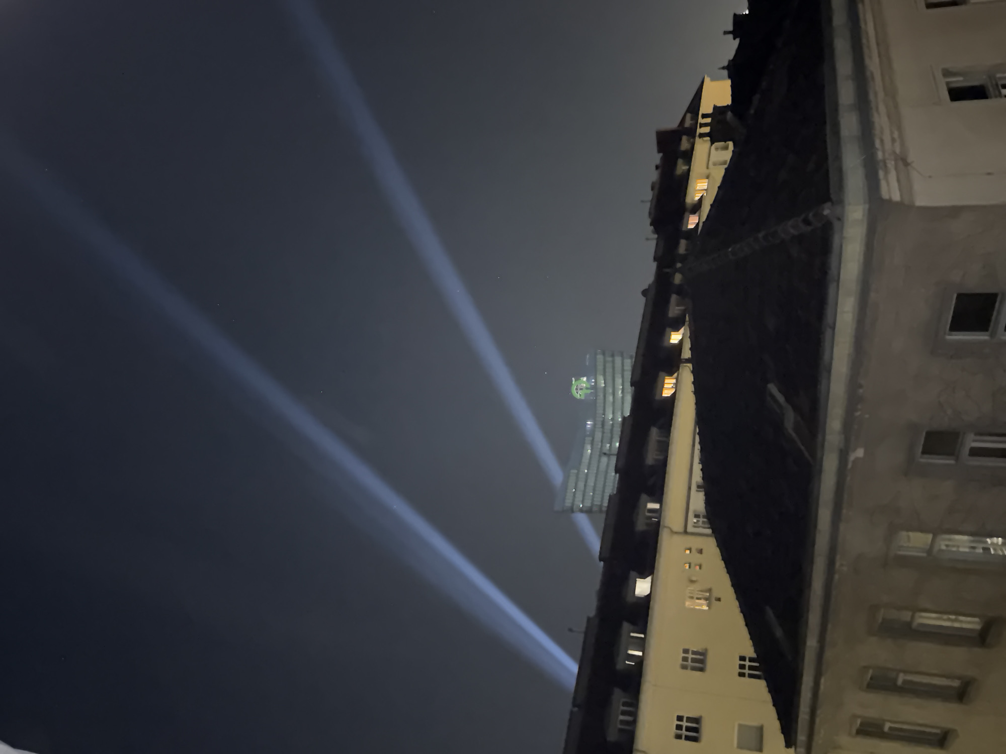 Bright light beams rise over Vienna's night skyline
