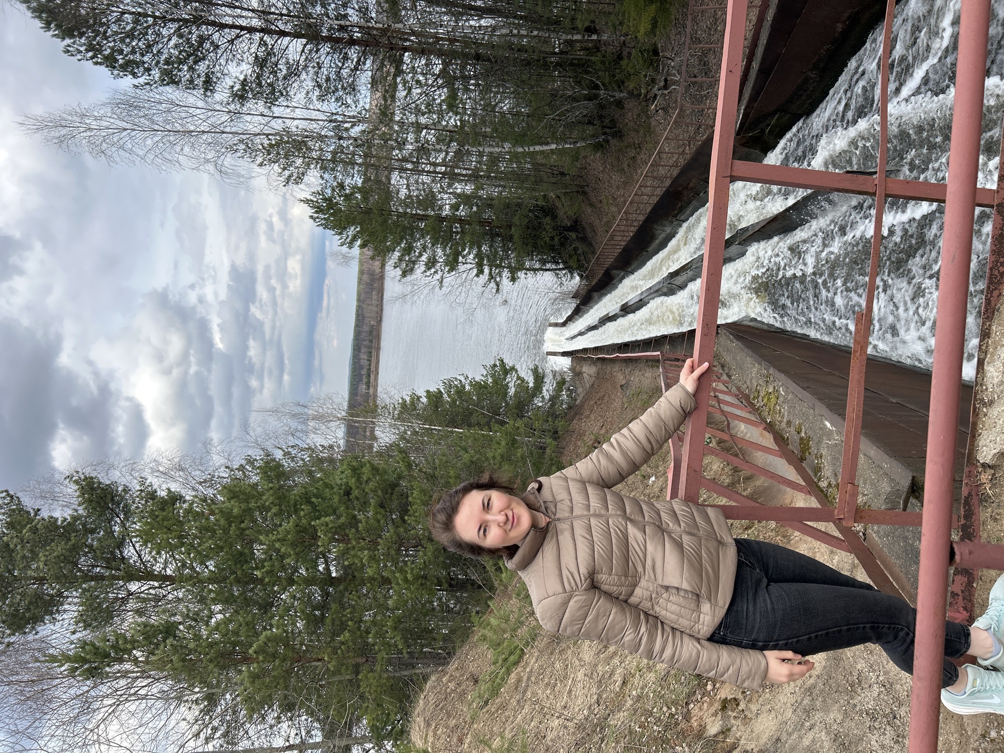 Woman photographed at waterfall overlook in Chernushka, Russia