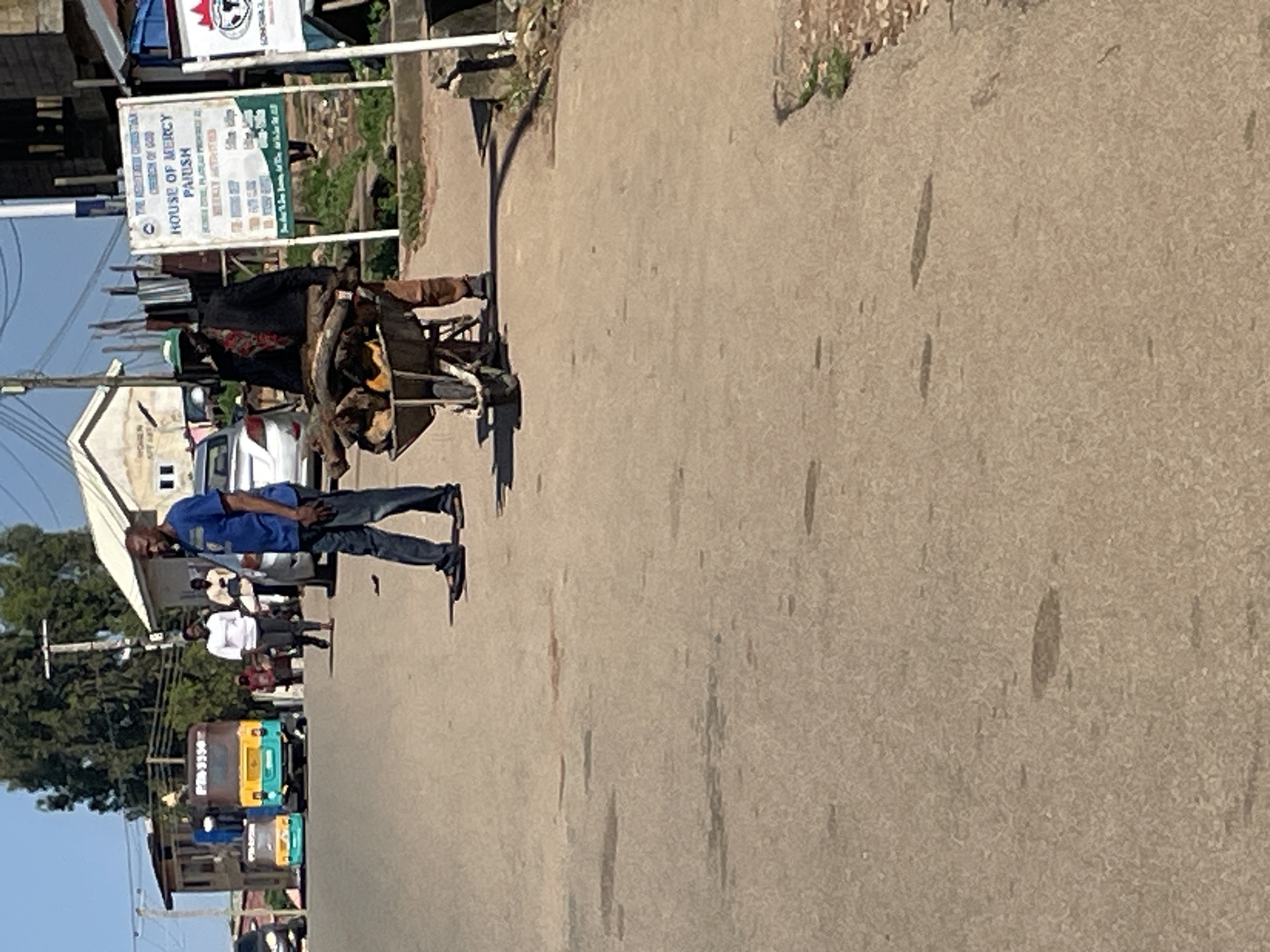 Everyday street activity across Jos, Nigeria on a sunny morning