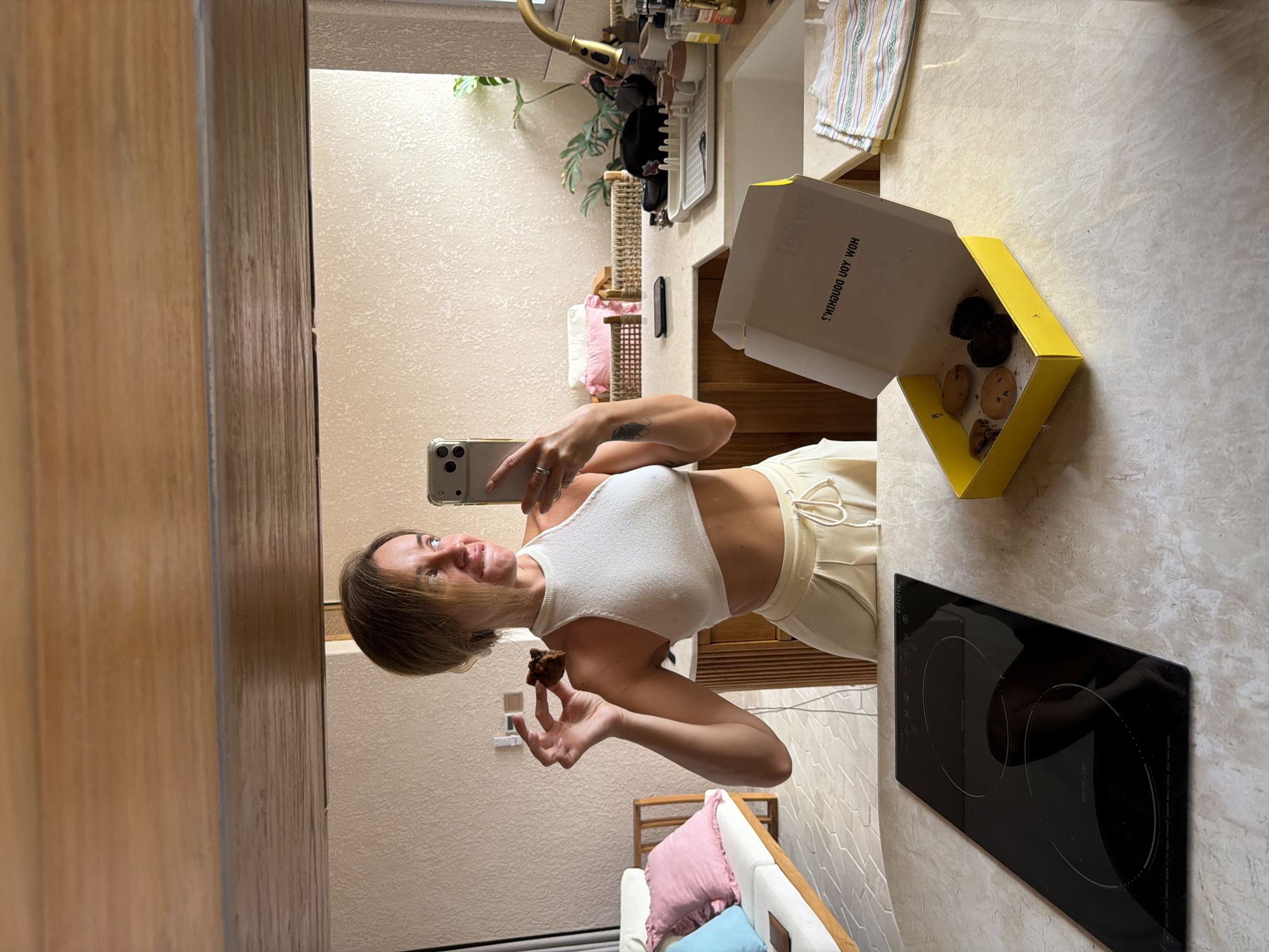 Mirror selfies in a modern Mengwi kitchen with cookies