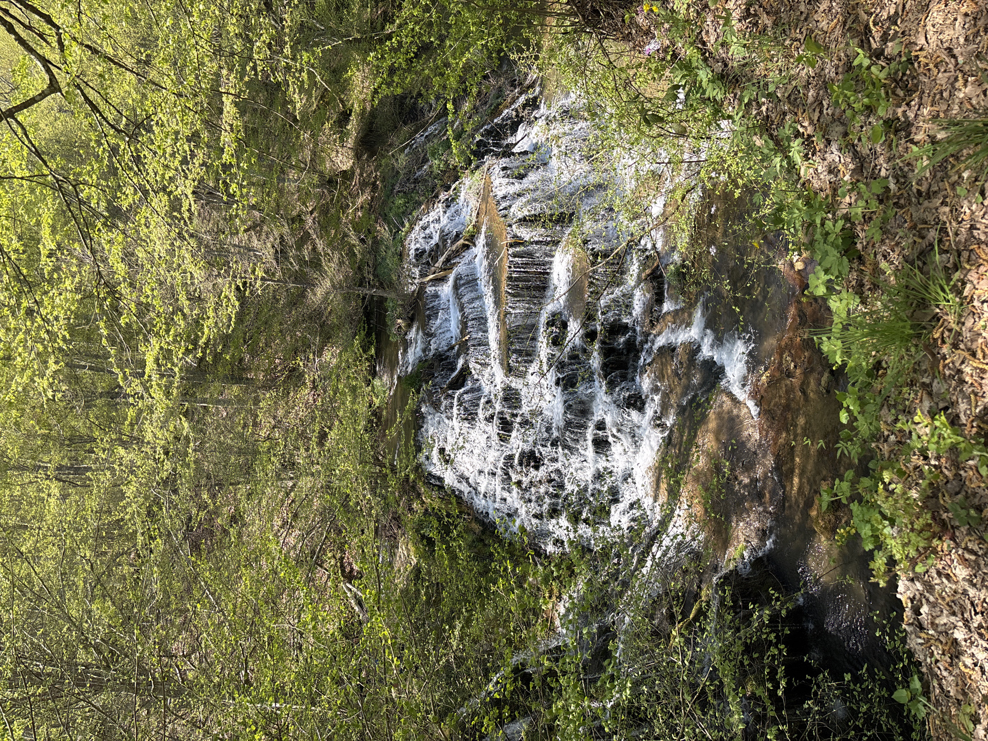 Rural waterfall and traditional houses documented in Stoilovo, Bulgaria