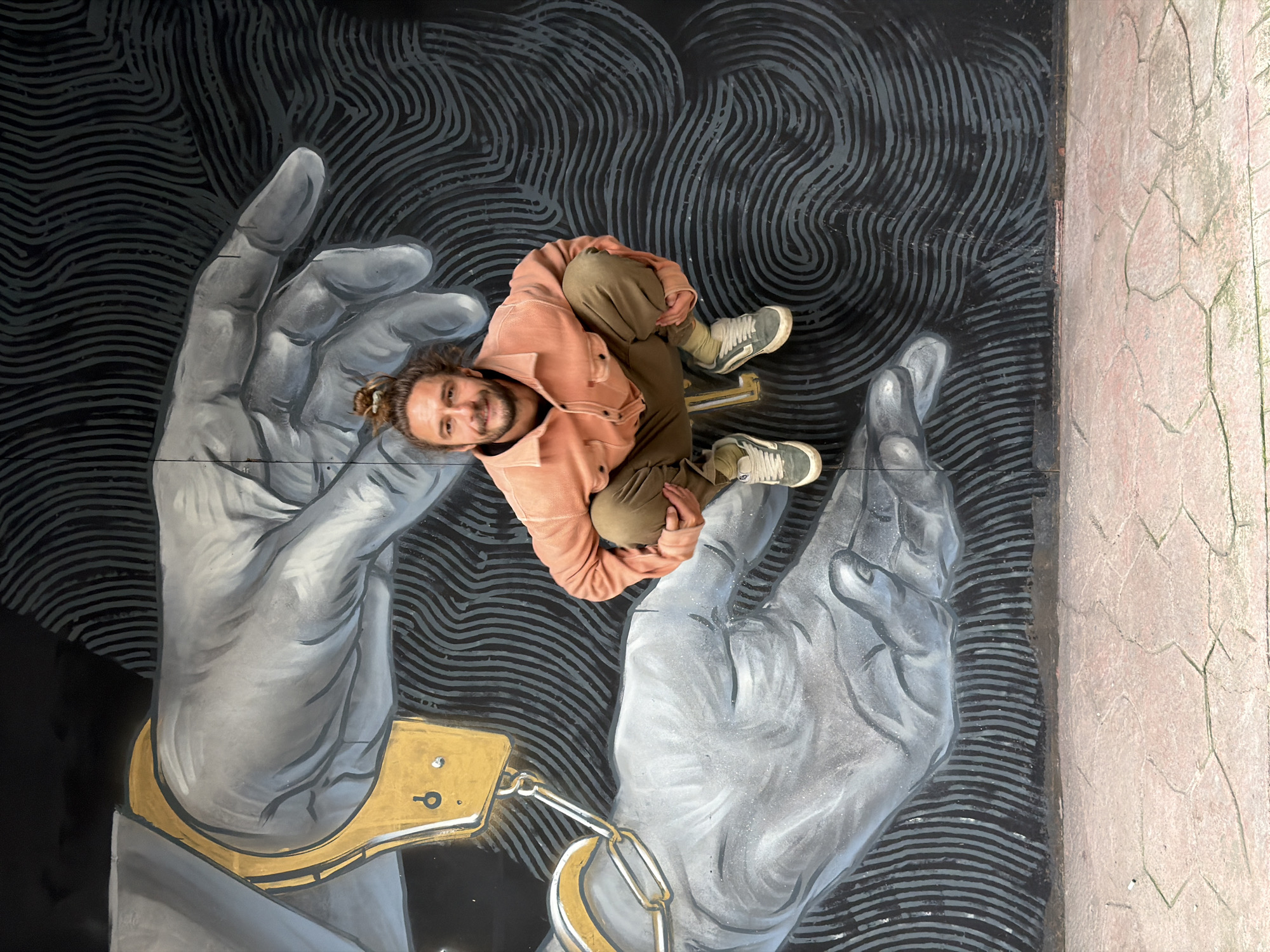 Man poses on street mural in Istanbul's Beyoğlu district