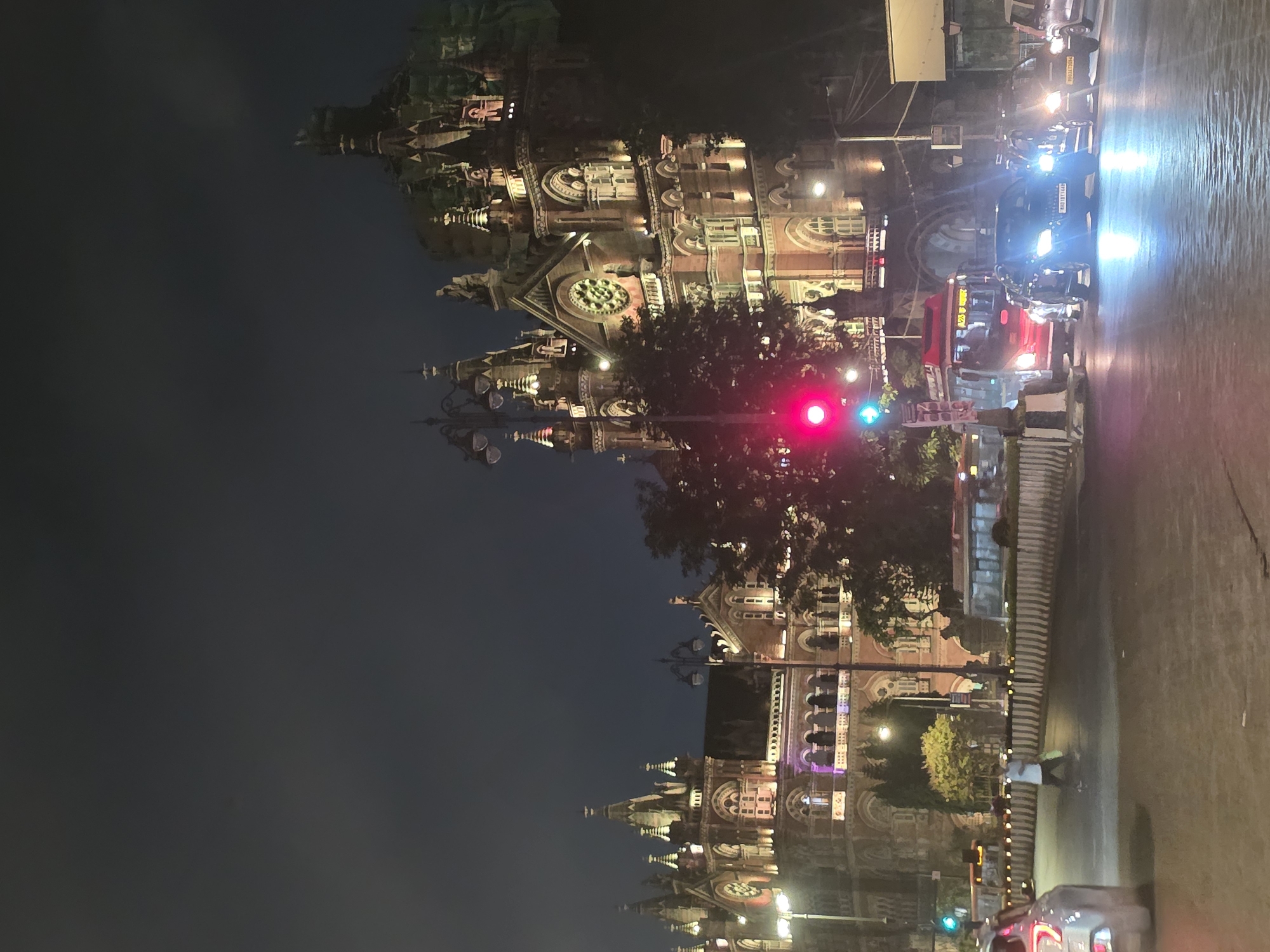 Mumbai's Historic Railway Terminal Illuminated During Evening Hours
