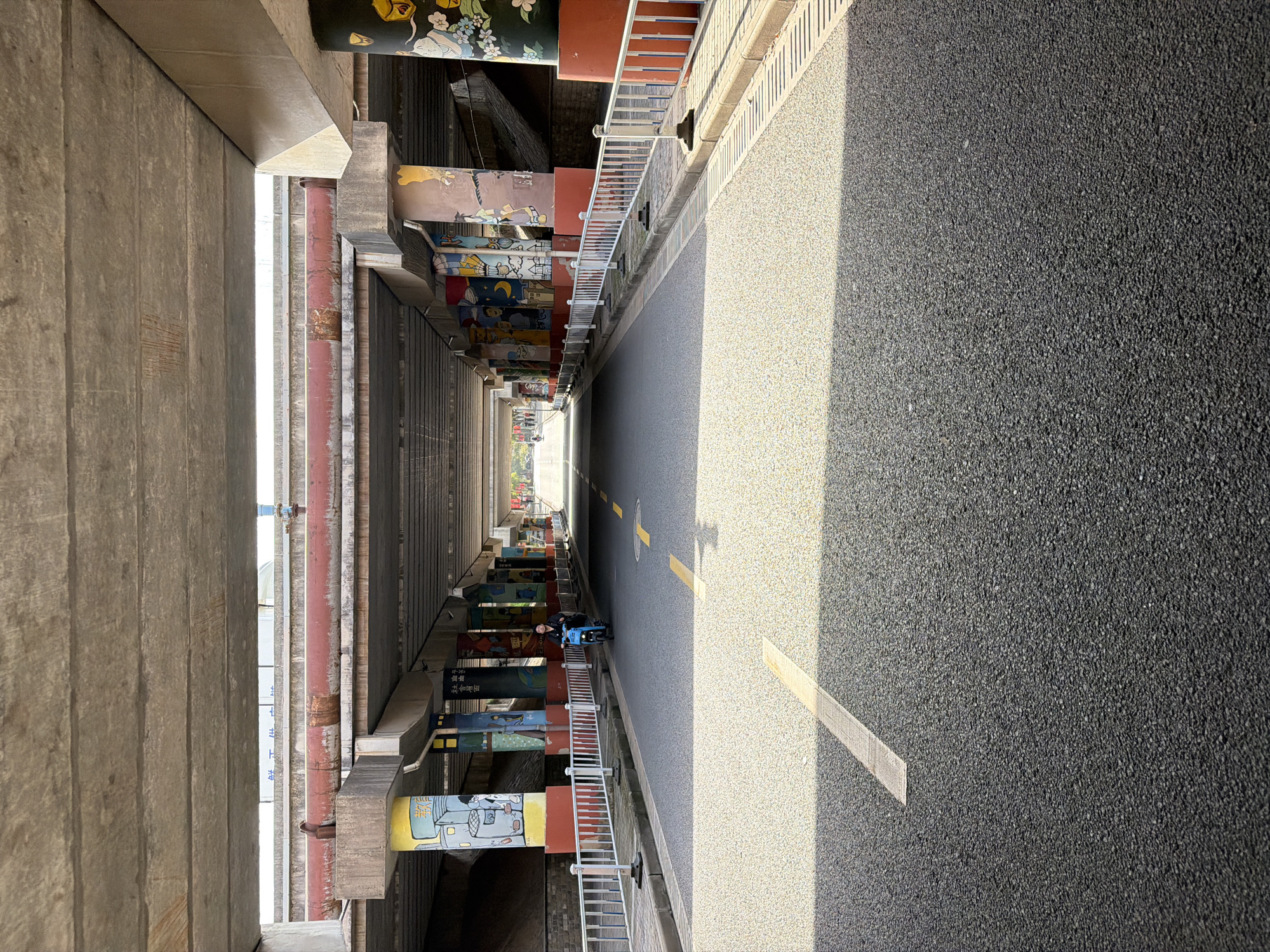 Roadway observed between concrete structures in Jiangning District