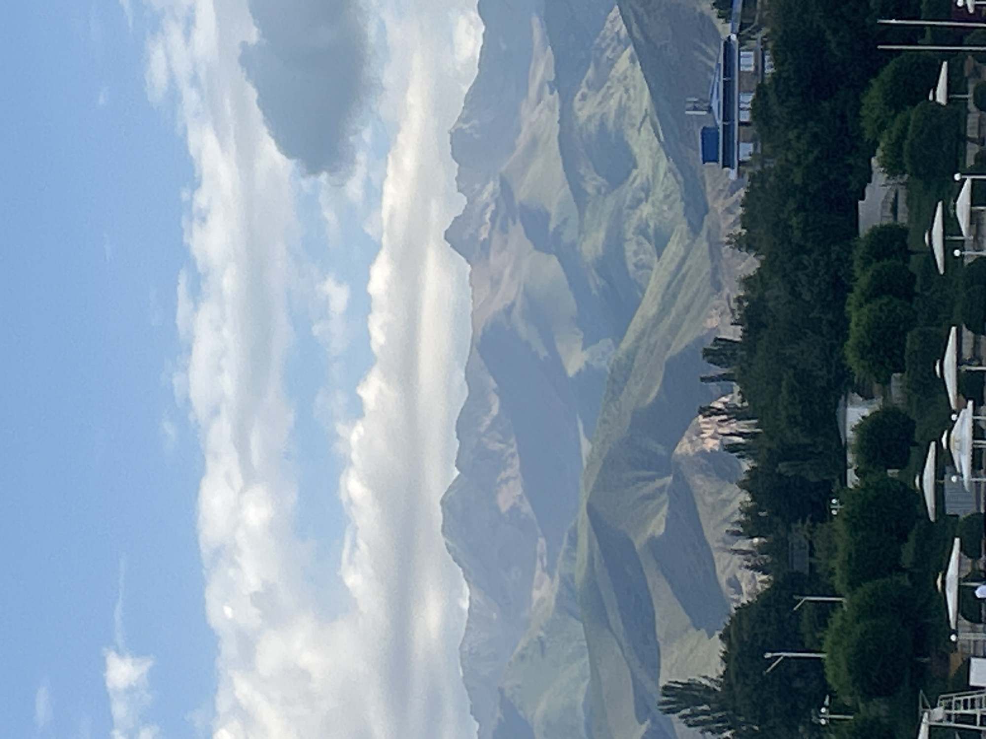 Sunrise over Issyk-Kul Lake and mountain forests, Bosteri