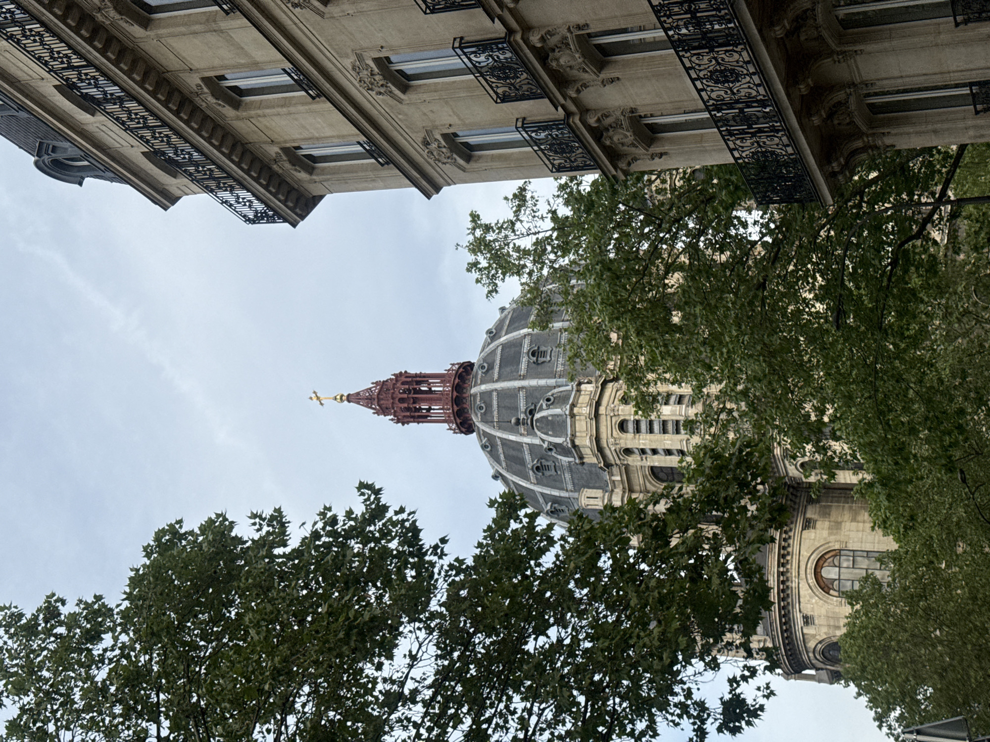 Parisian dome architecture photographed from street level perspective