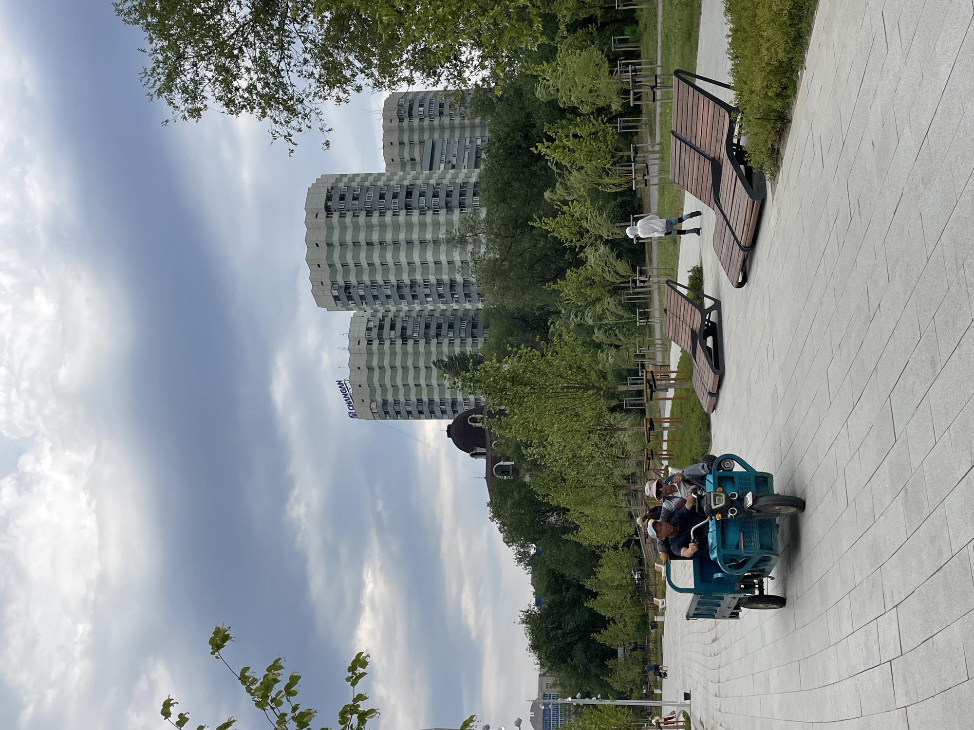 Almaty lakeside park buzzes with visitors and groundskeeping crews