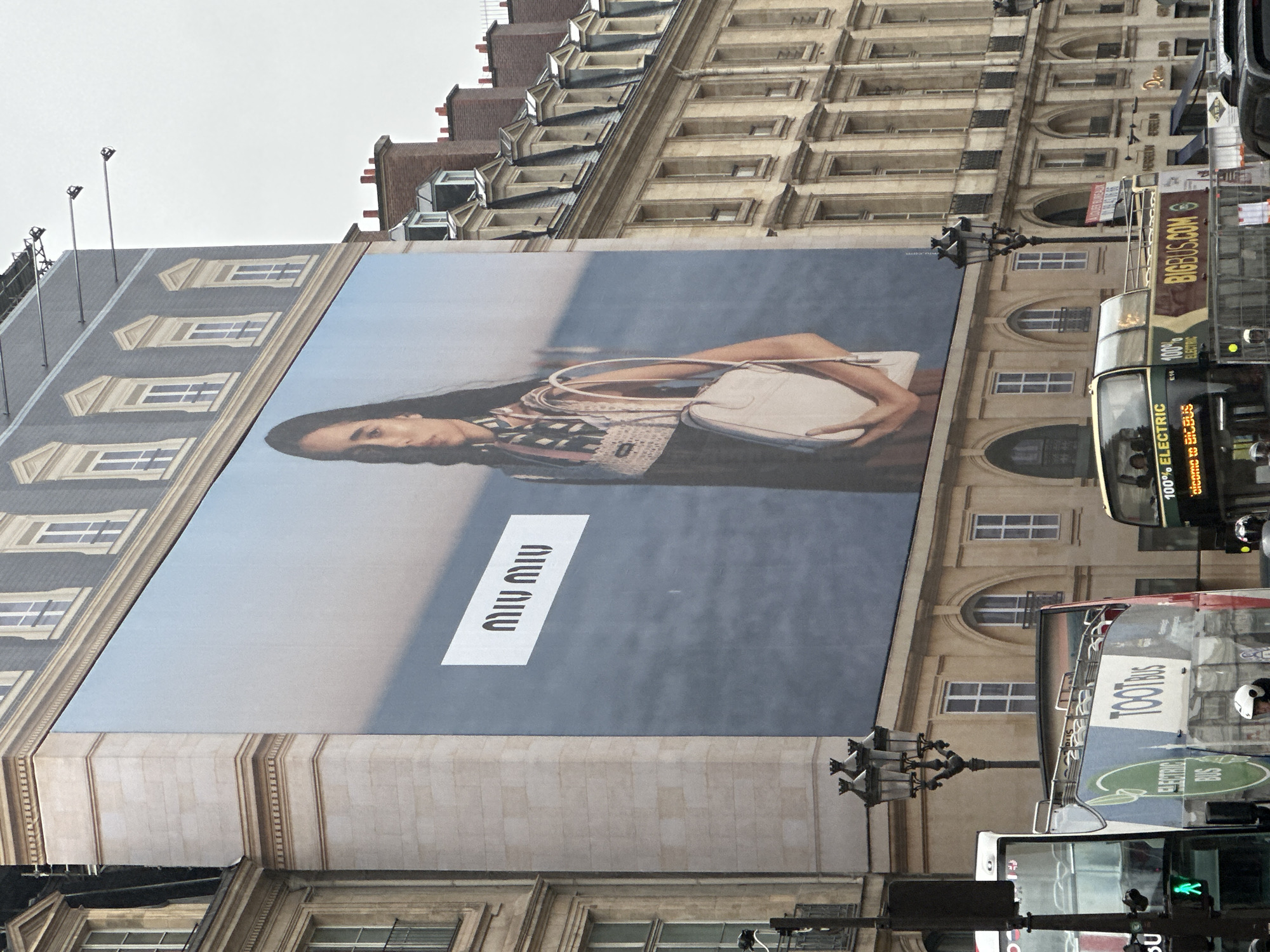Rainy day street life in Paris luxury shopping district
