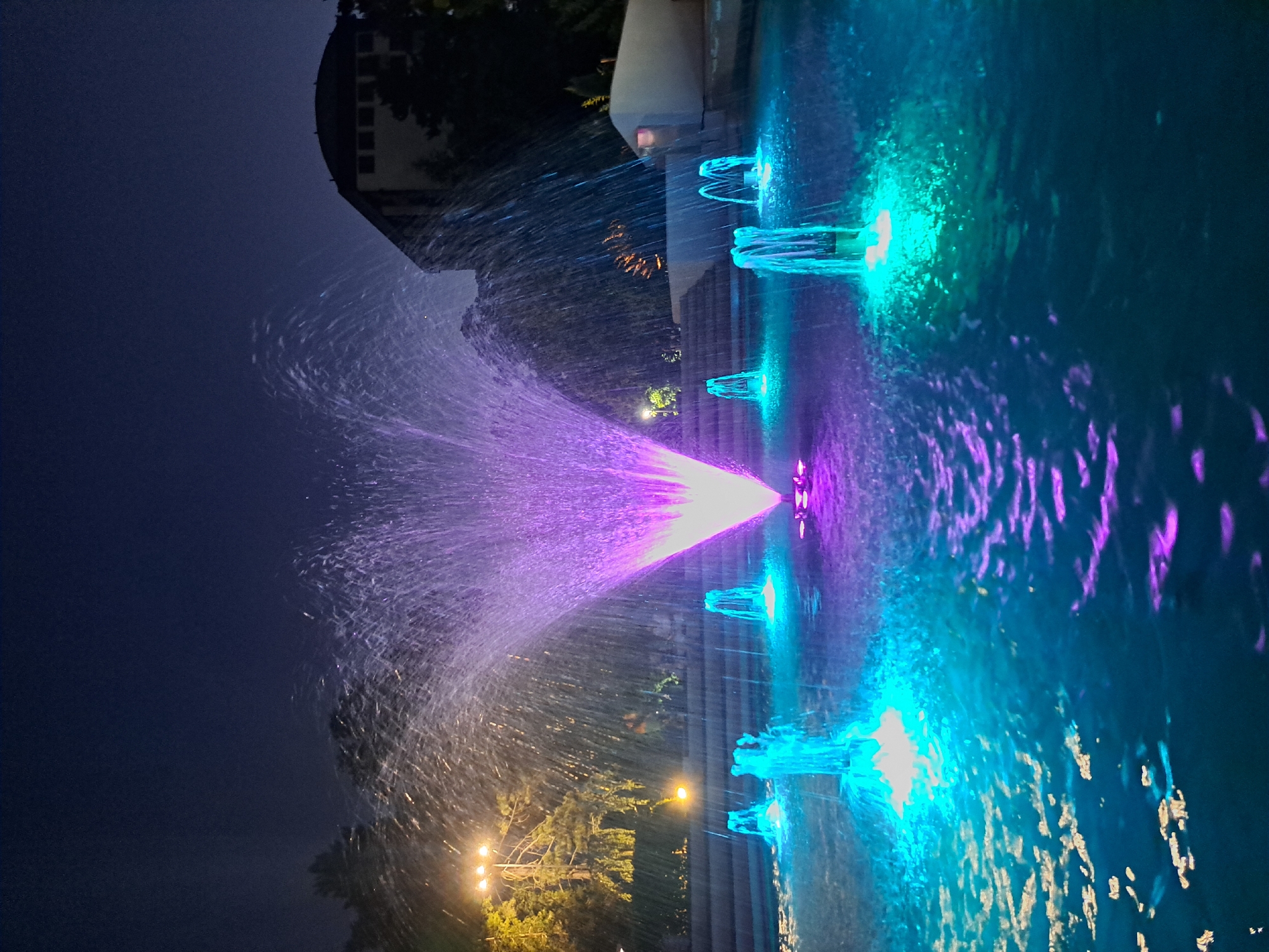 Colorful fountain light show in Popovo's town square