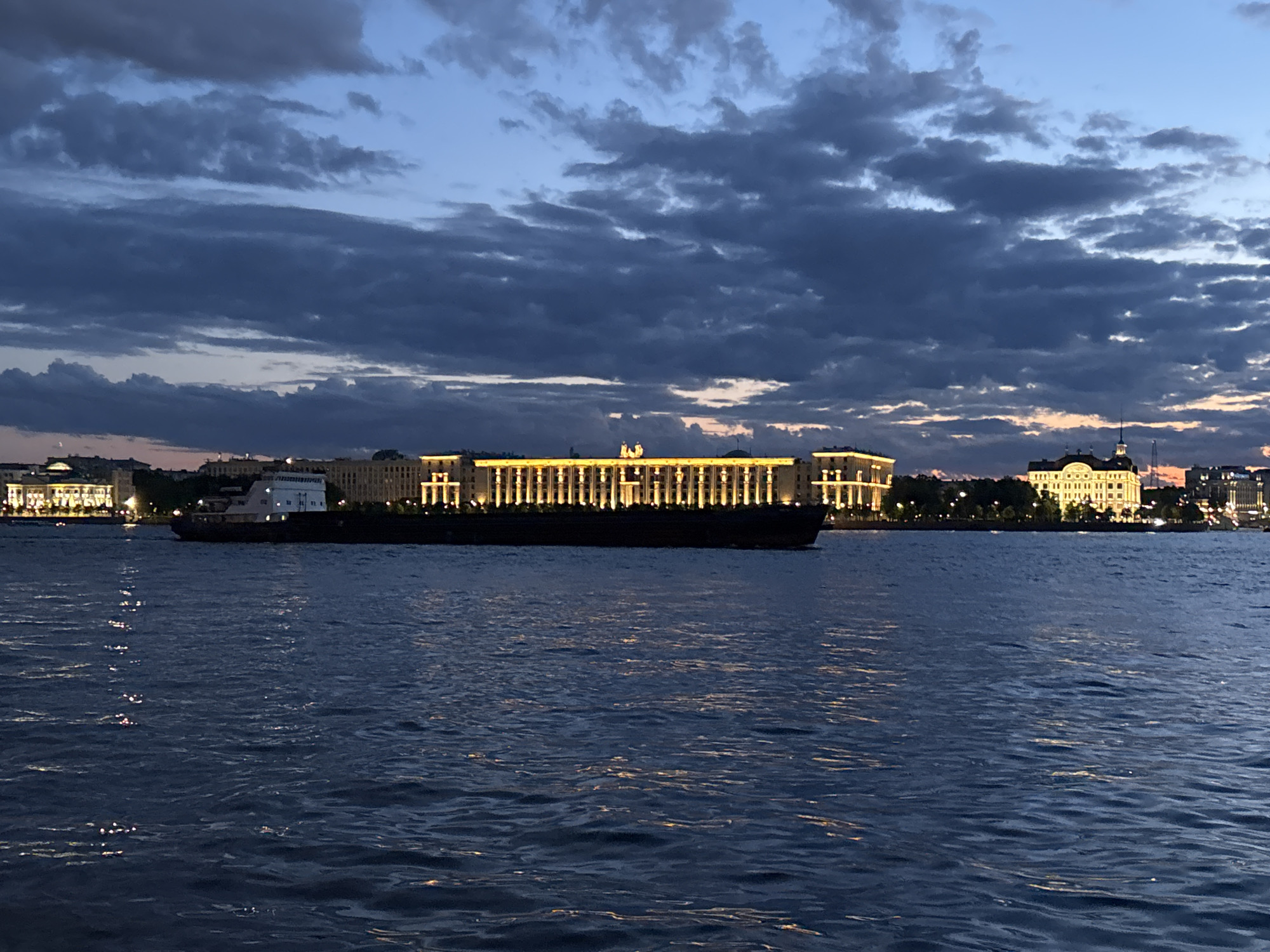 White Nights on the Neva: boats, embankments, and a glowing skyline