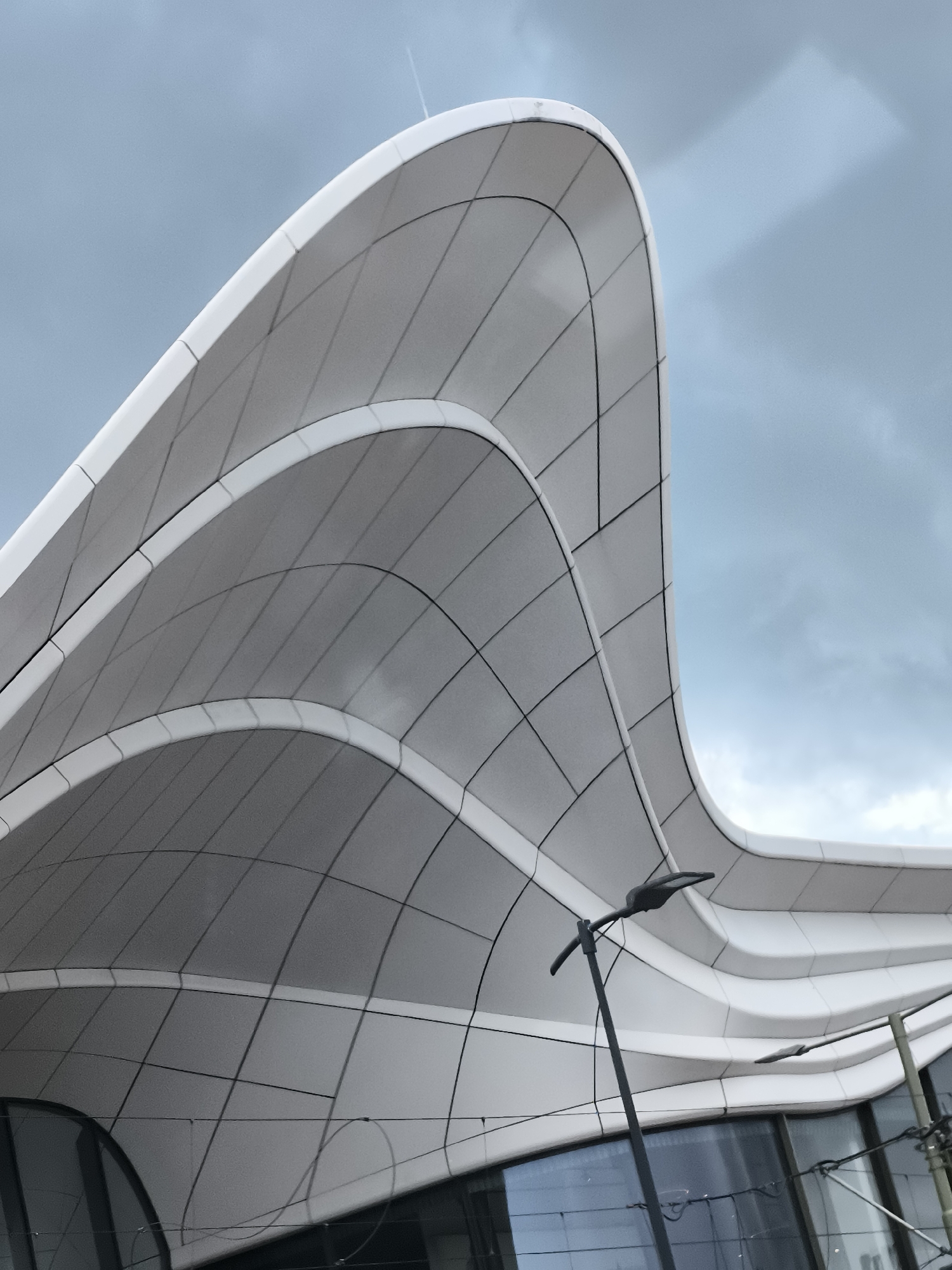 Forum Mall's curved white architecture documented in Leidschendam