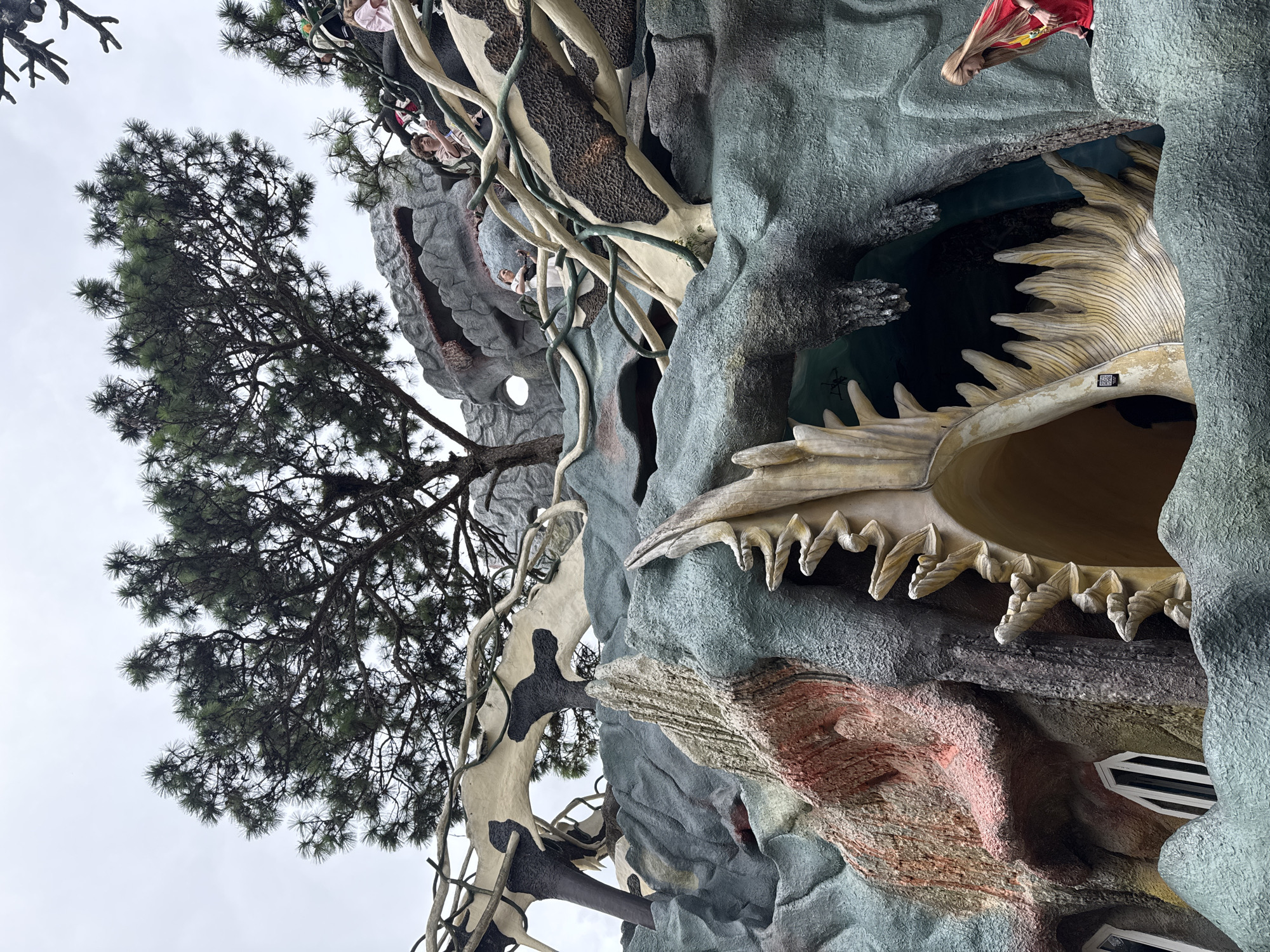 Tourist documents whimsical sculptures at Vietnam's Crazy House attraction