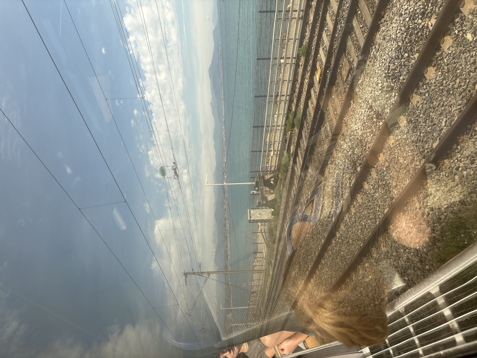 Train travels scenic coastal route in Antibes, France