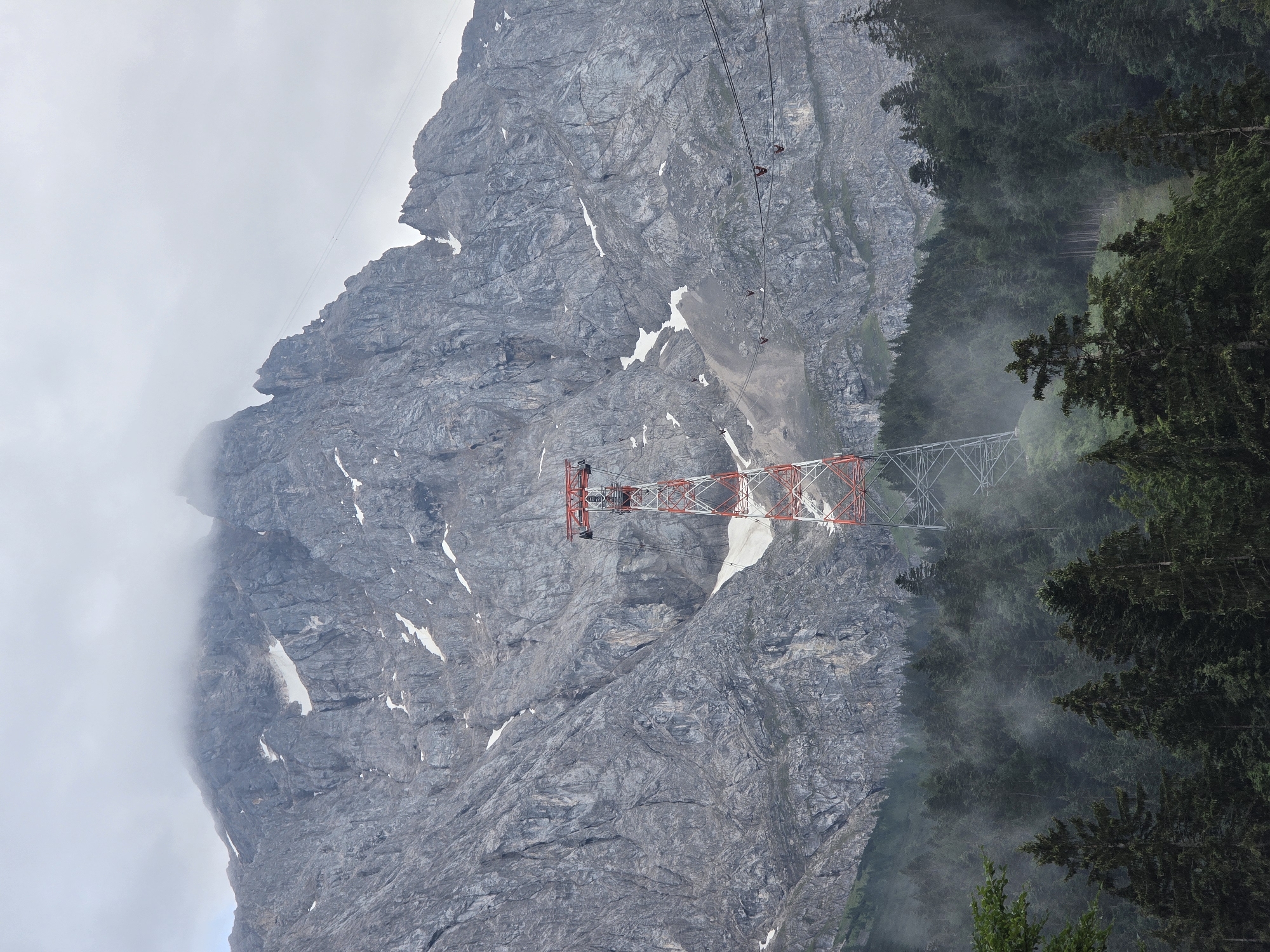 Eibsee at dawn: foggy lake, pine forest, Zugspitze cable car