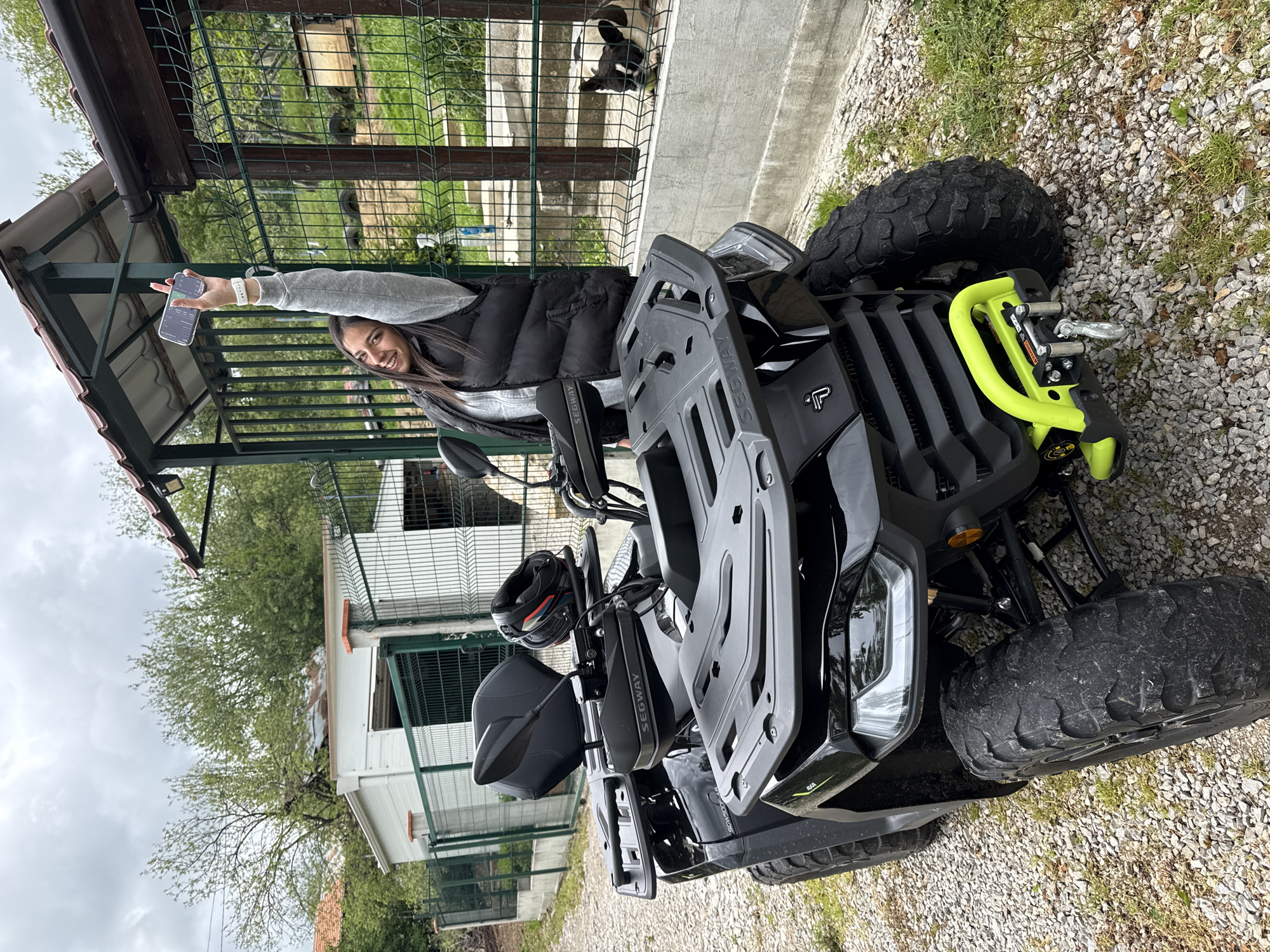Woman enjoys ATV ride with dog in Bulgarian village