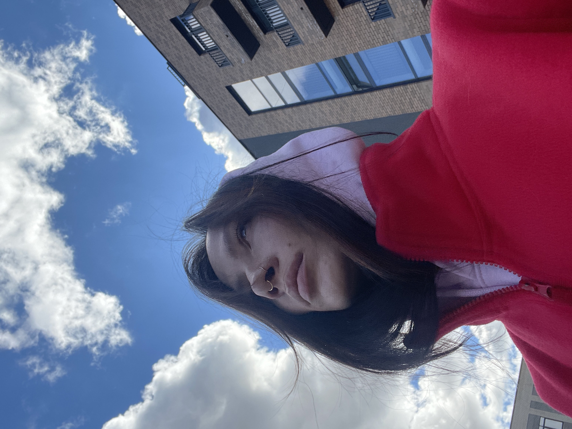 Woman in red hoodie photographed from below in Семёново