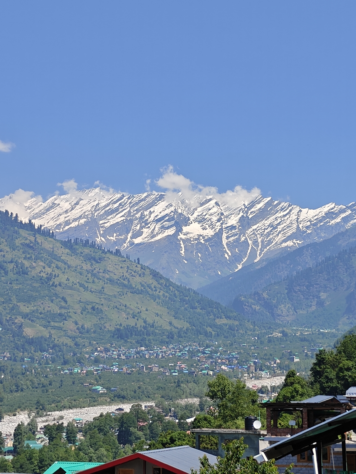 Early morning visitors explore traditional Vashisht Temple in Himalayas