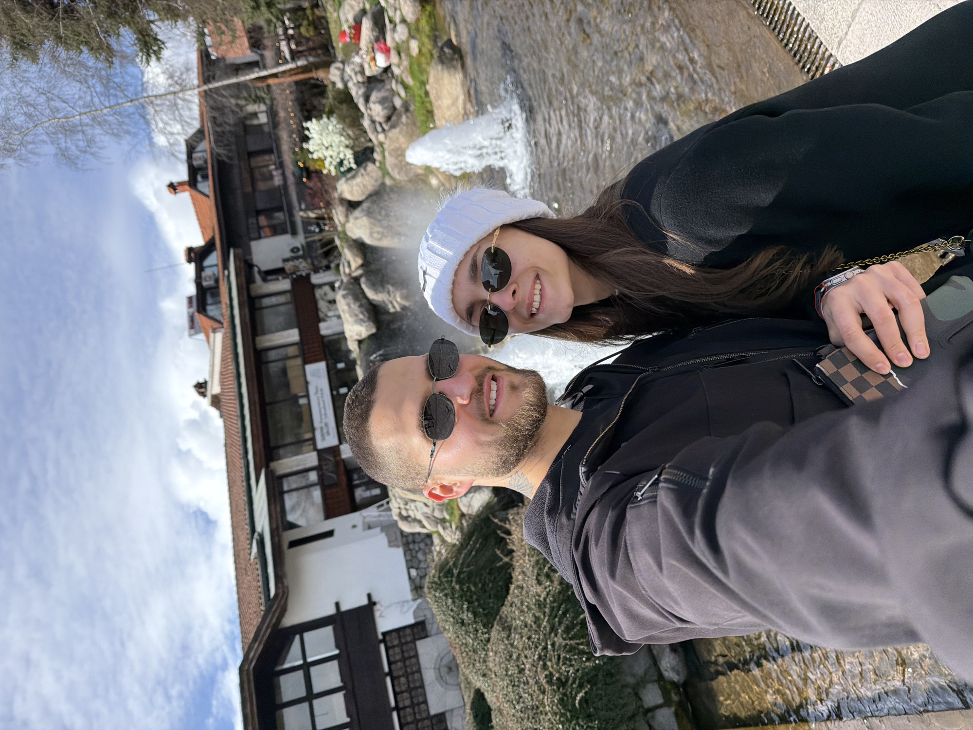 Couple documents sightseeing tour through Bansko, Bulgaria attractions