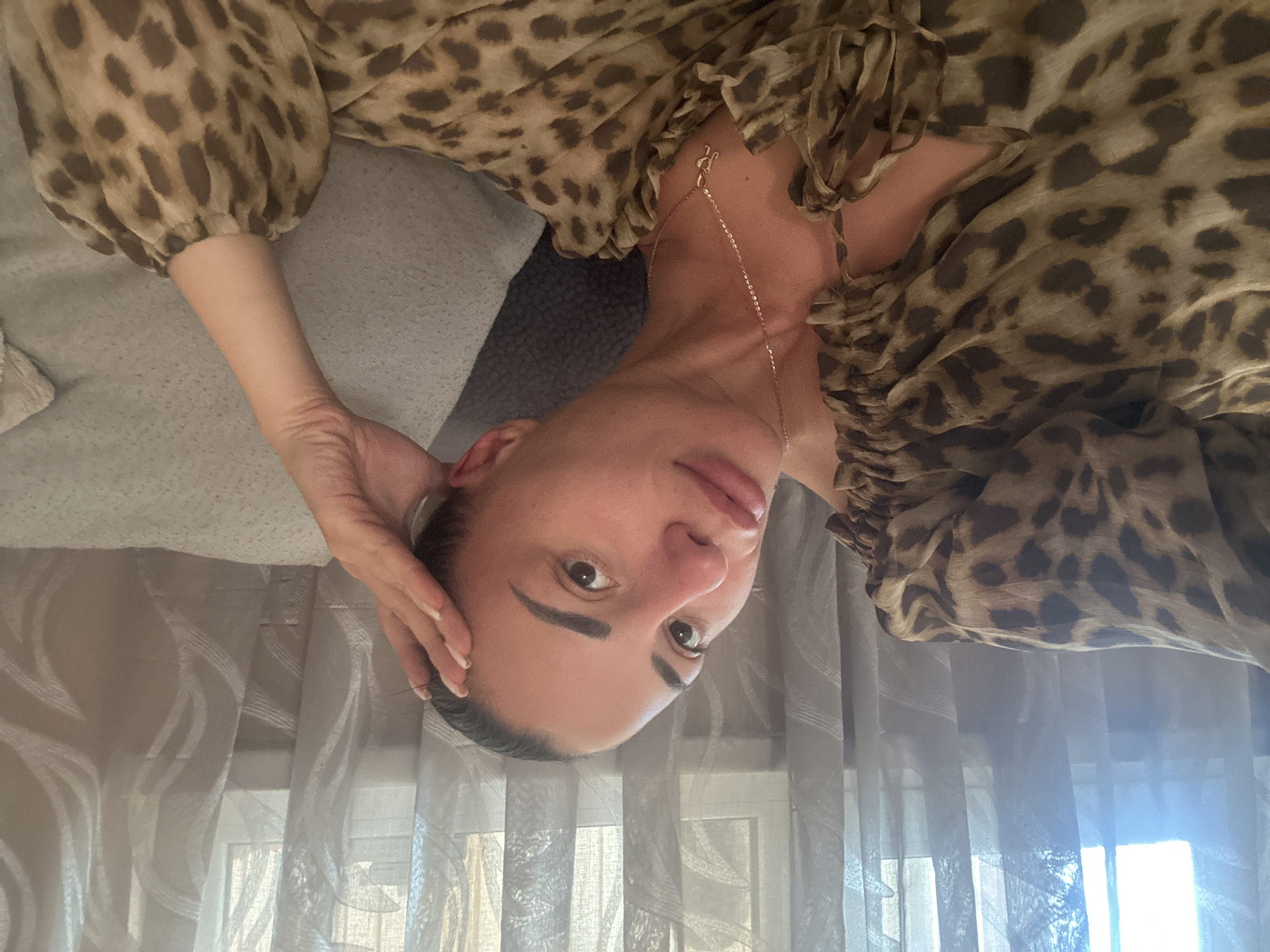 Woman photographed in animal print outfits in Burgas home