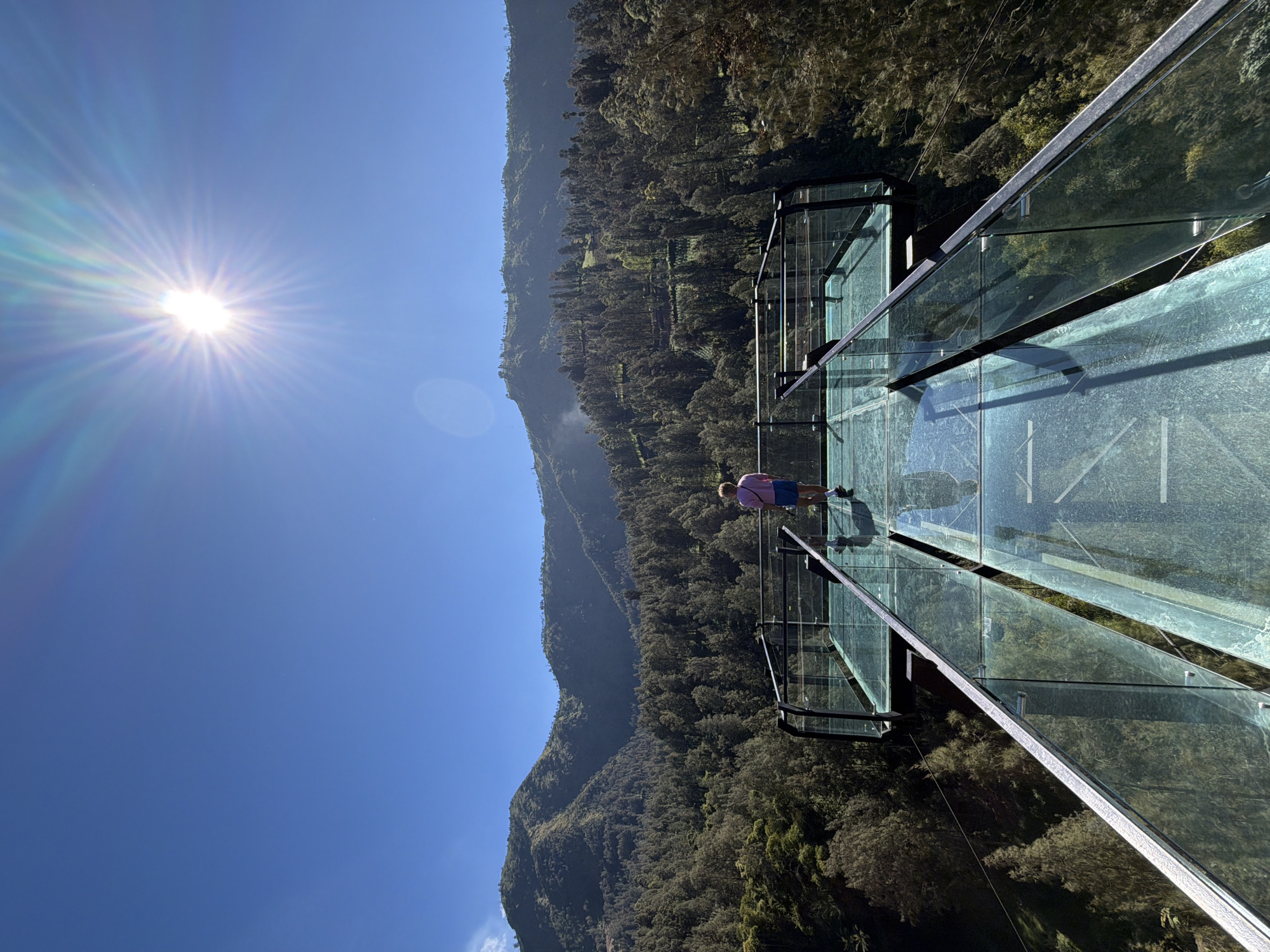 Glass observation deck over a forested valley in Jetak