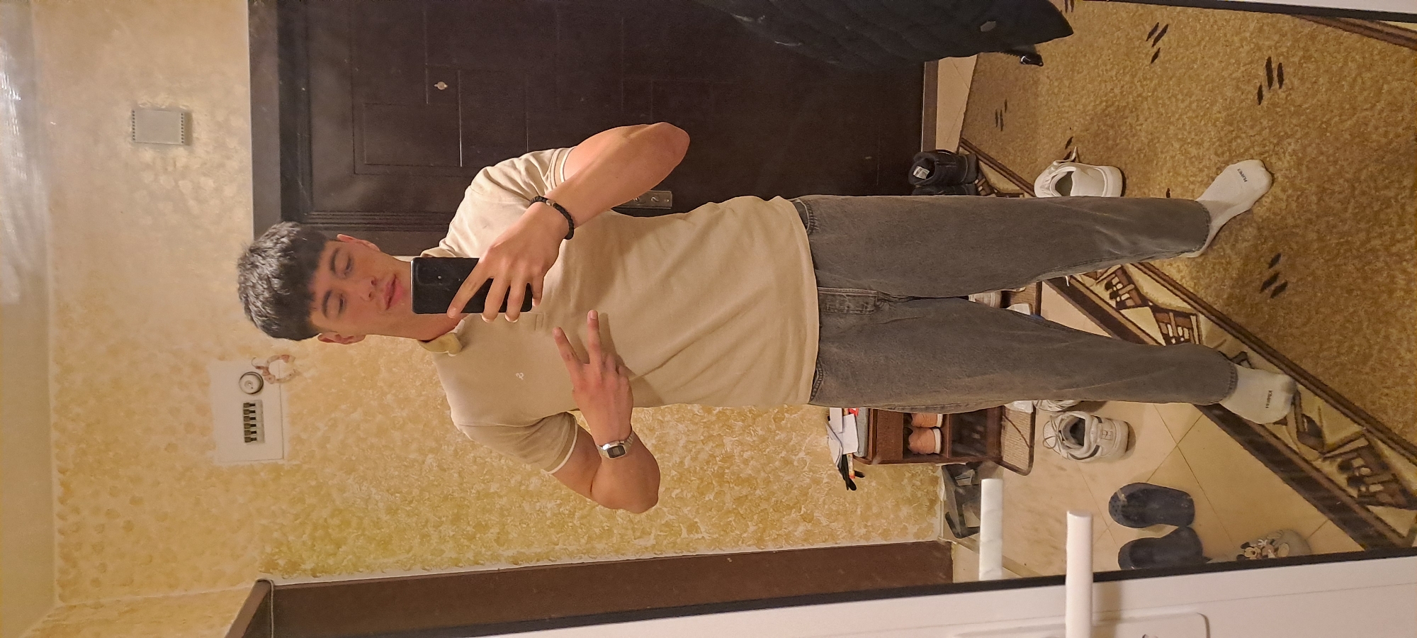 Person takes mirror selfies indoors in Burgas, Bulgaria