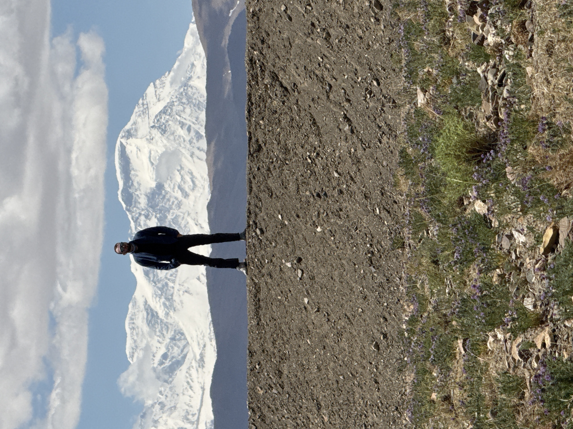 Solo traveler explores remote Gangga mountains at dawn