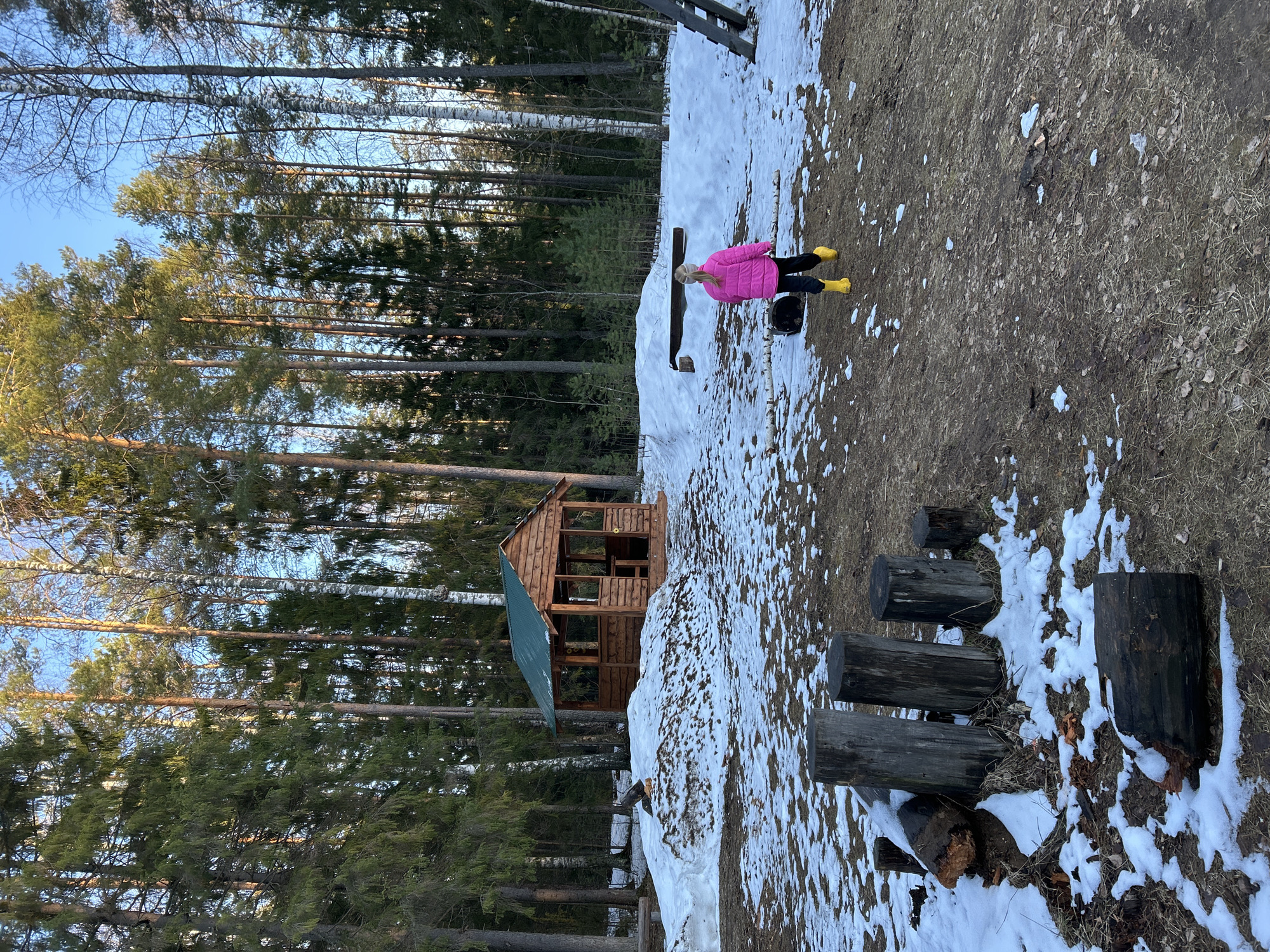 Mother, daughter visit snowy forest playground near Noviy, Russia
