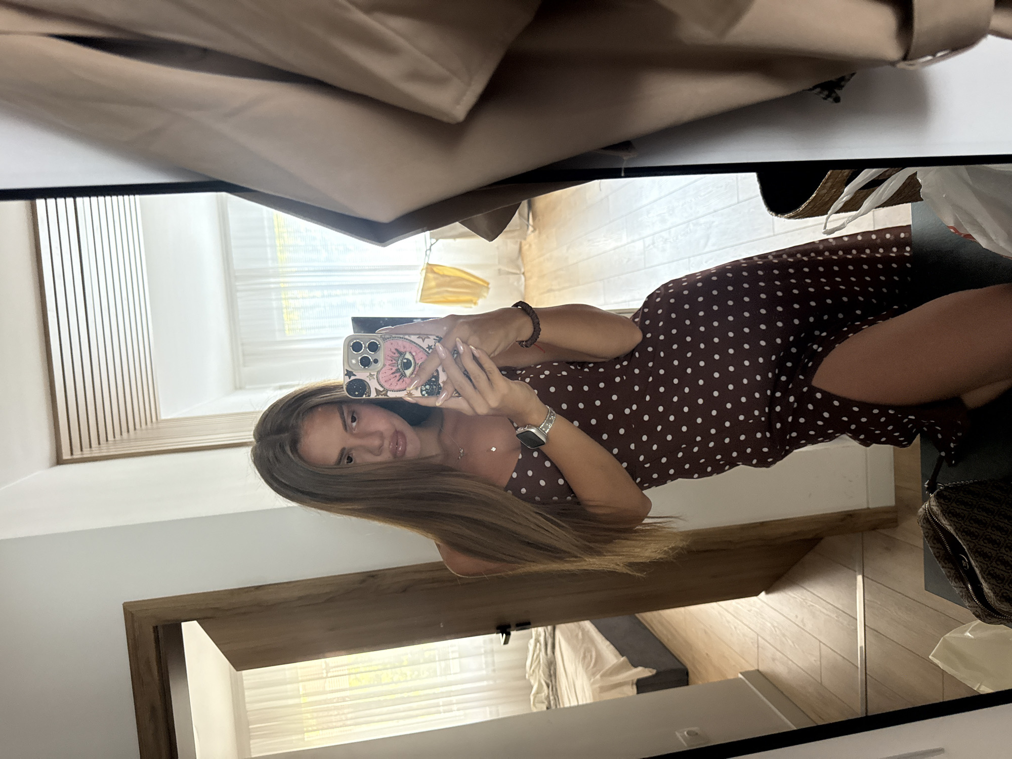 Mirror selfie in a Plovdiv bedroom, polka dot dress