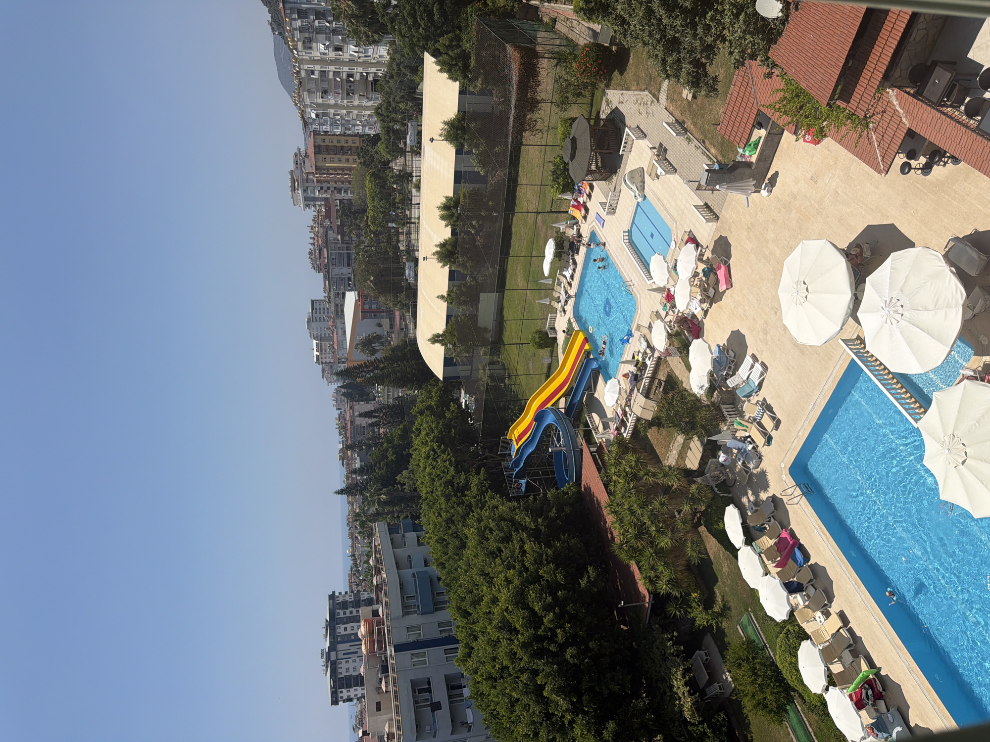 Resort pools and city streets on a sunny morning