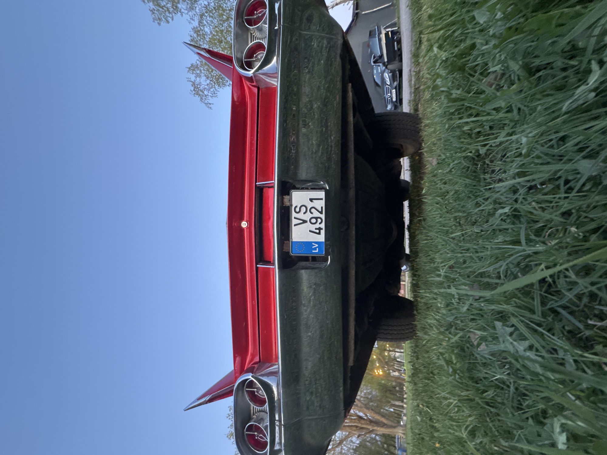 Red vintage car with tailfins spotted in Riga