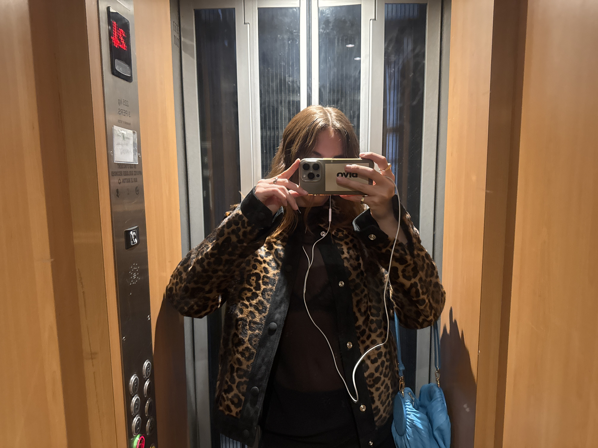 Woman documents Paris visit with elevator selfies, city views